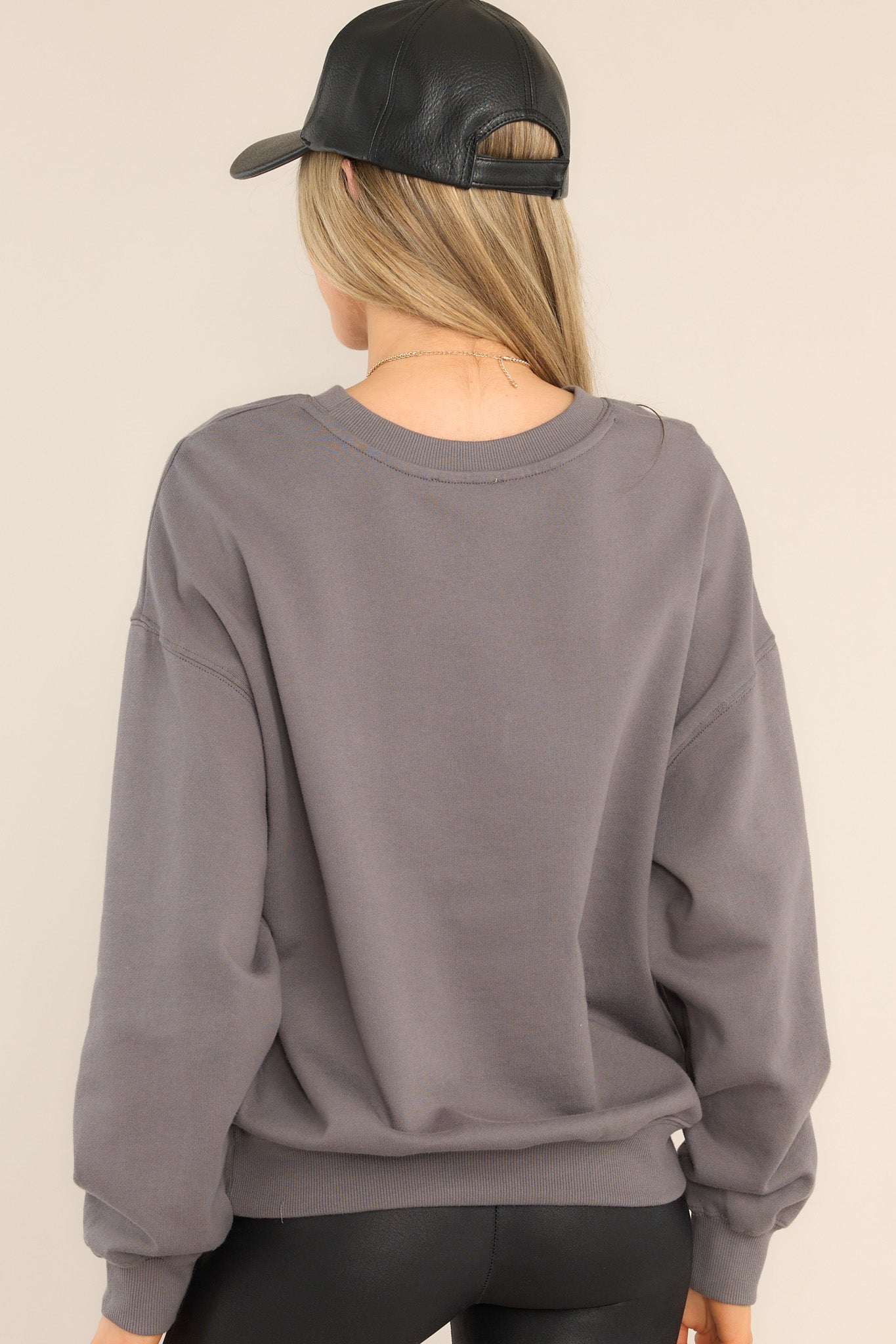 Back view of this sweatshirt that features a ribbed crew neckline, dropped shoulders, a Zion graphic, ribbed cuffed long sleeves, and a ribbed hemline.