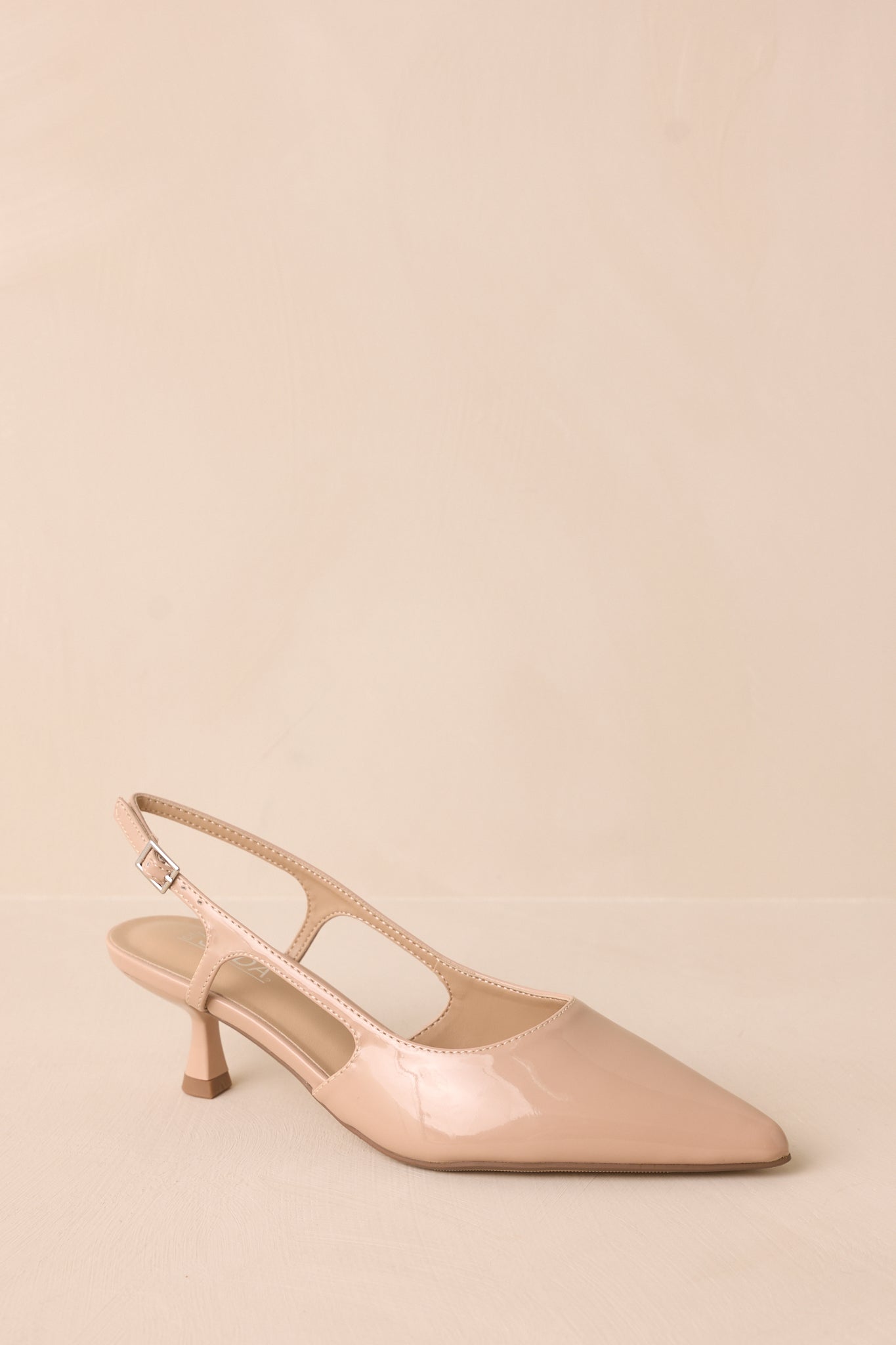 Fiercely Stunned Nude Patent Kitten Heels