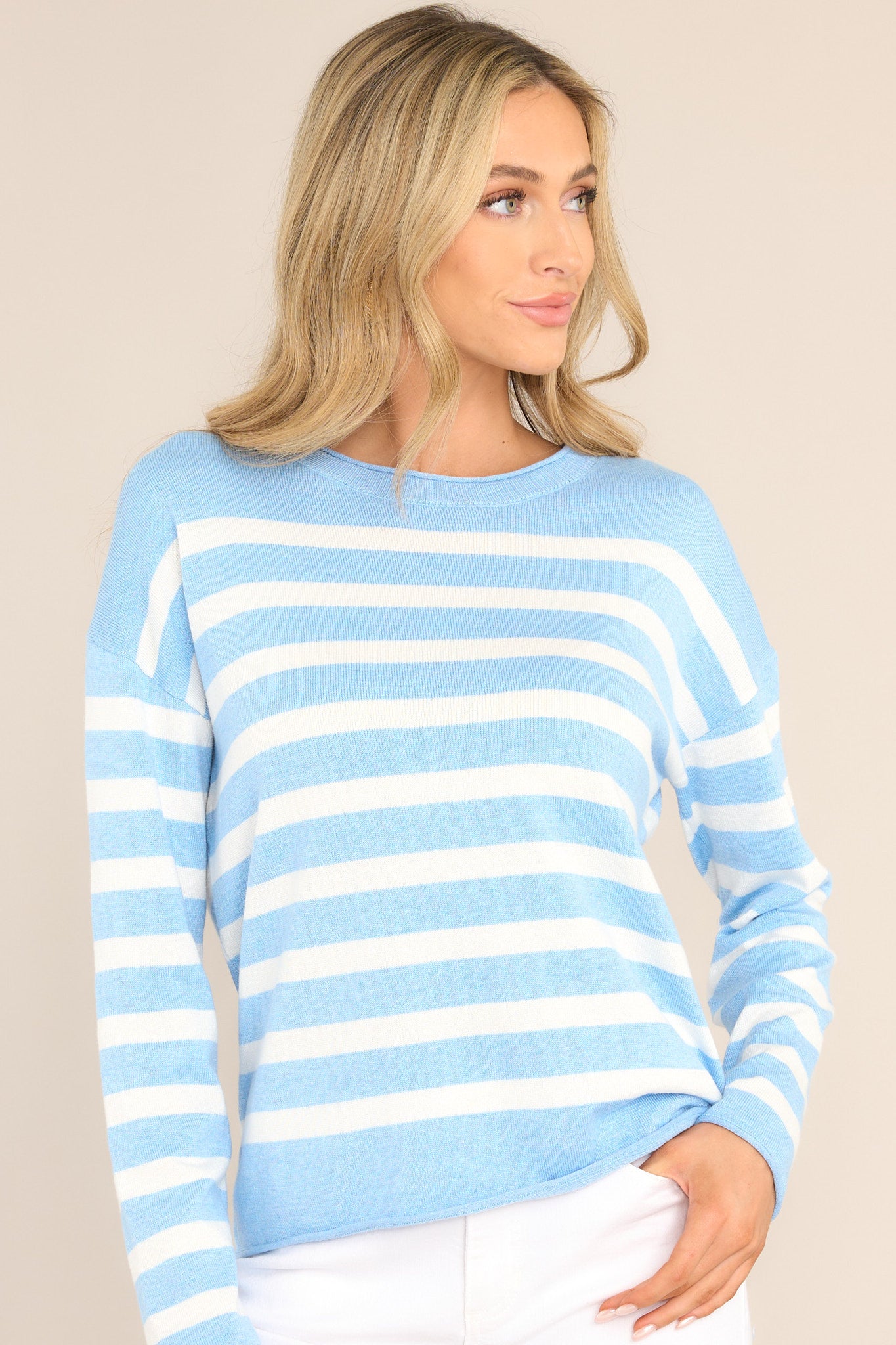 Front view of this sweater that features a ribbed crew neckline, dropped shoulders, a super soft material, and cuffed long sleeves.