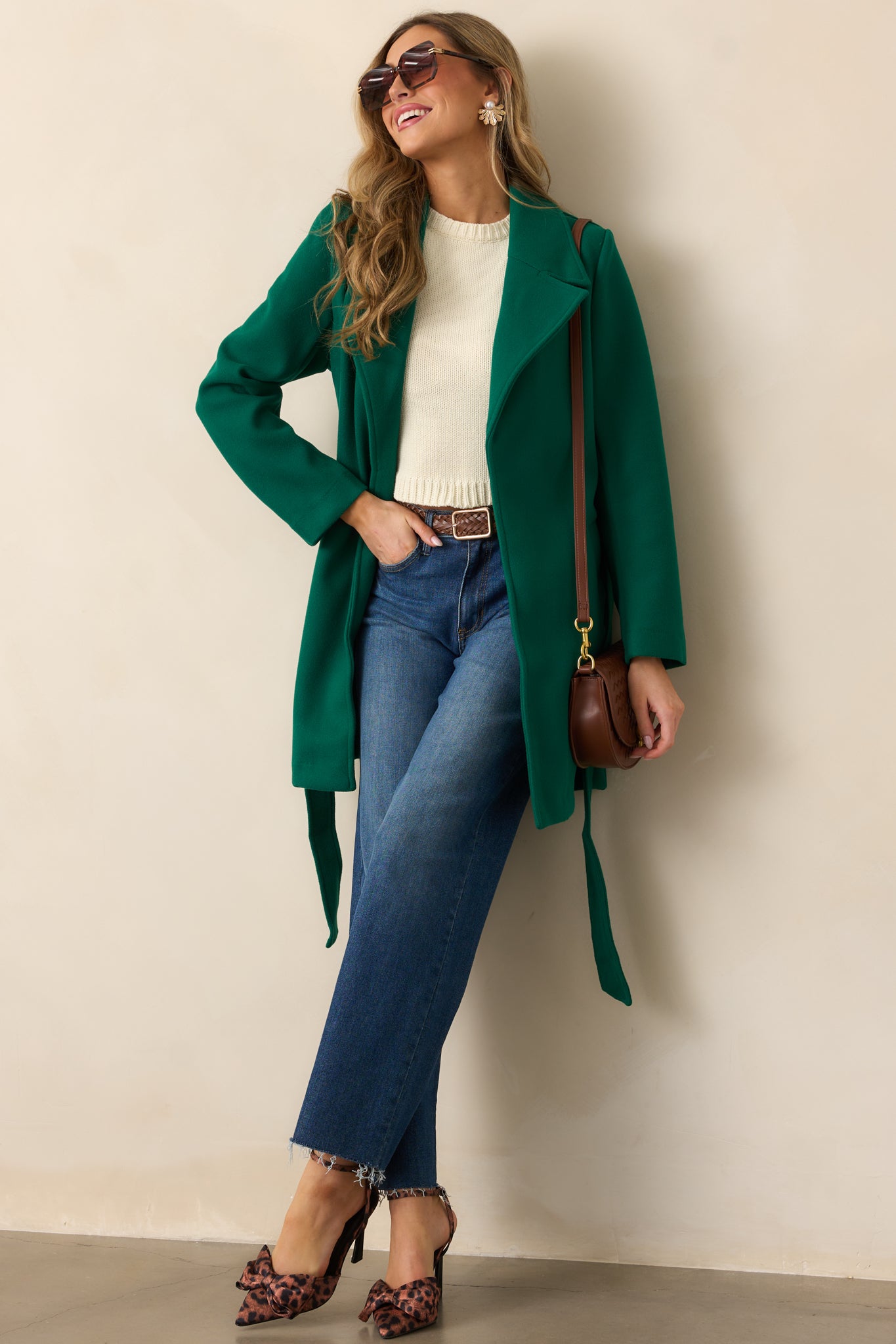 A full-length view of the kelly green coat, focusing on the double-breasted button details and structured lapels.