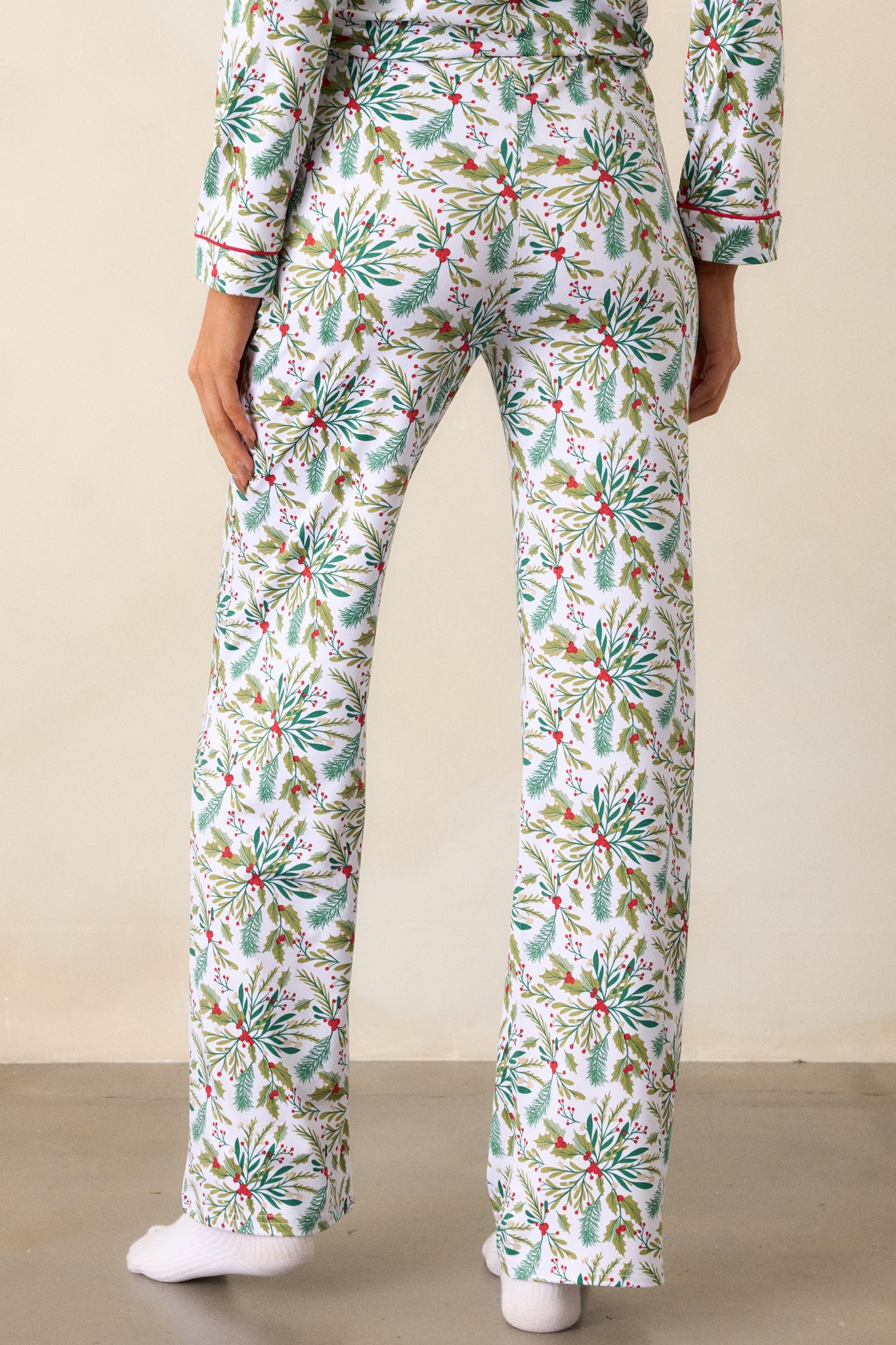 Back view of the ivory pajama pants, showcasing the relaxed leg silhouette and the overall comfort-oriented design.