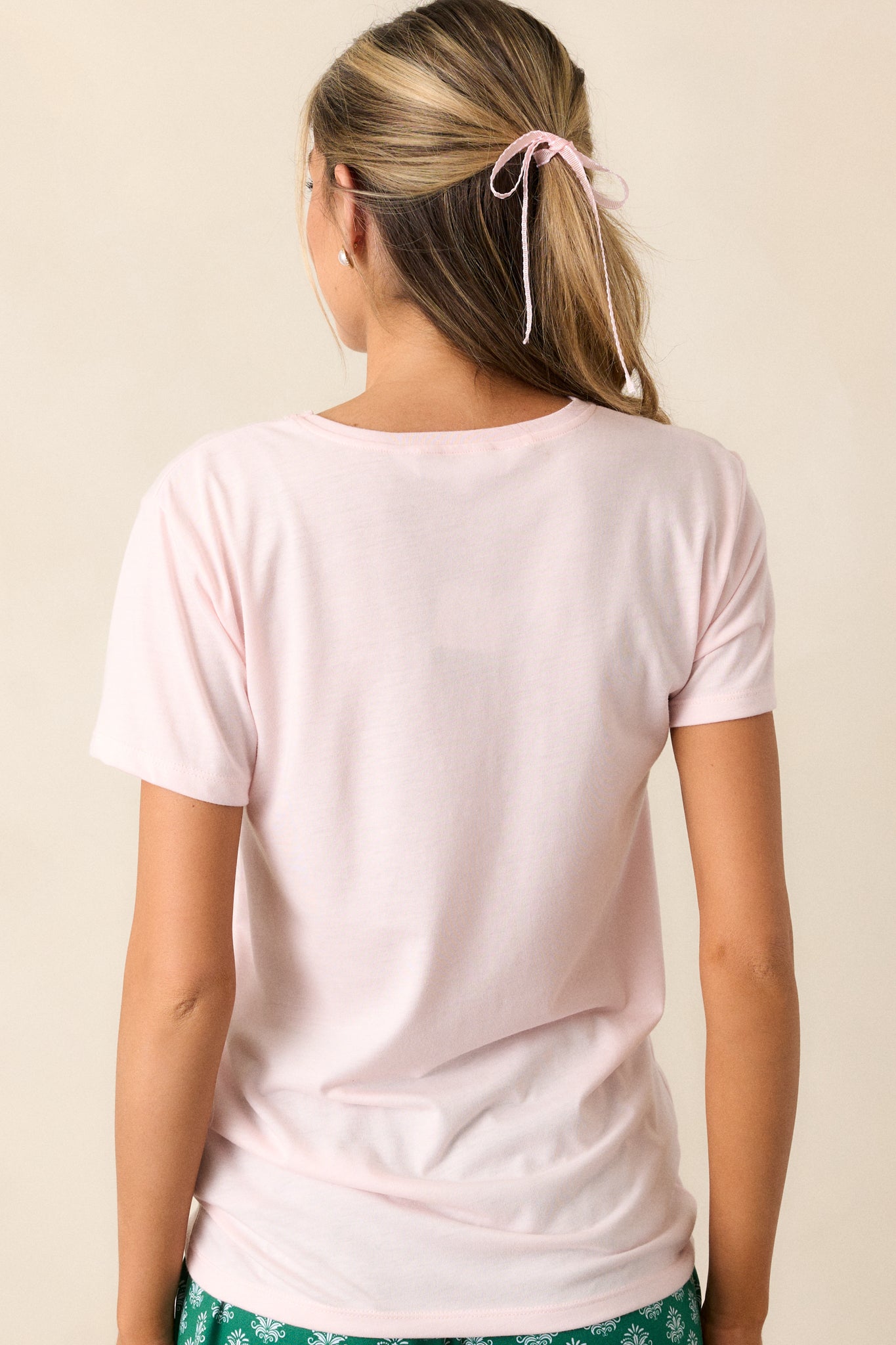 Back view of the pajama top, highlighting the simplicity of the design and the relaxed fit of the fabric.