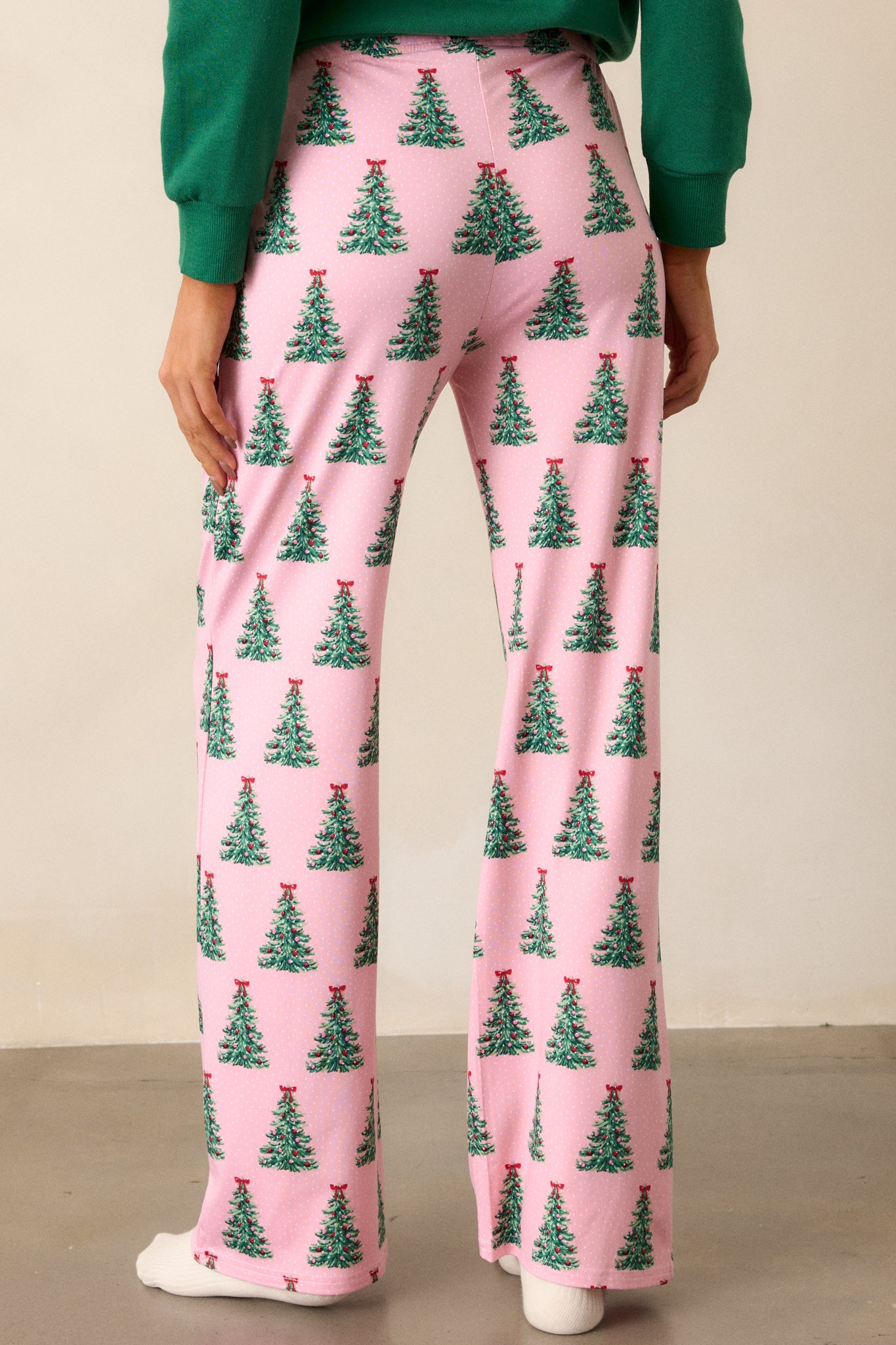 Back view of the pajama pants, highlighting the full-length design and showcasing how the waistband sits comfortably at the back while maintaining a festive look.