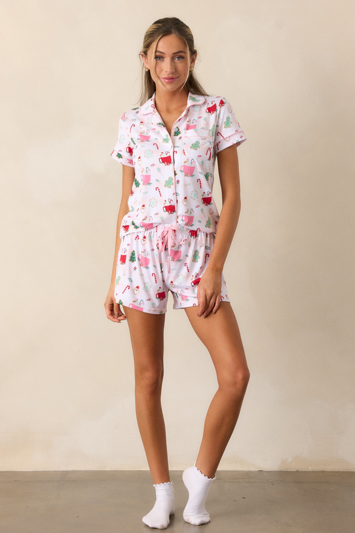 Another front view of the ivory pajama shorts, highlighting the fun holiday hot cocoa and treats print, with a focus on the overall silhouette.