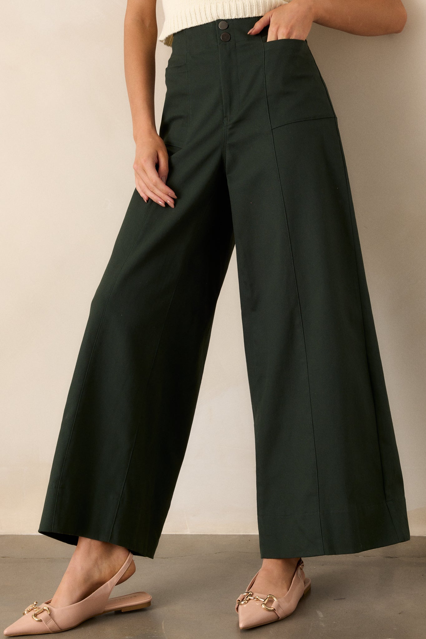 A cropped angle of the pants that captures the fabric texture and the clean lines of the wide leg, showcasing its tailored appearance.