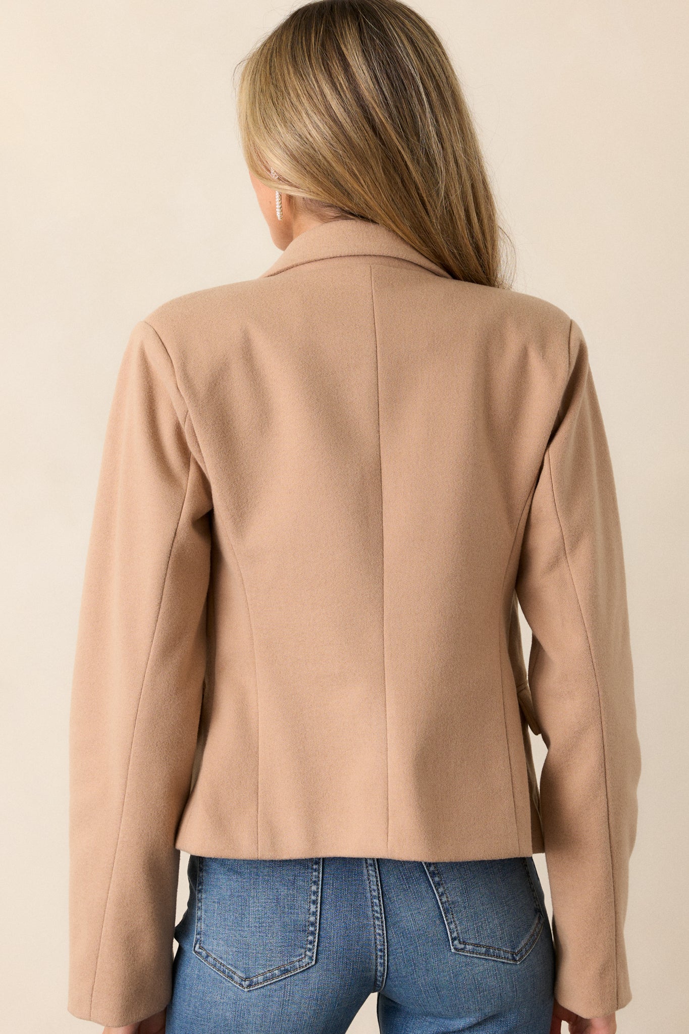 A rear view of the tan blazer, displaying the cropped boxy fit and clean lines across the back.