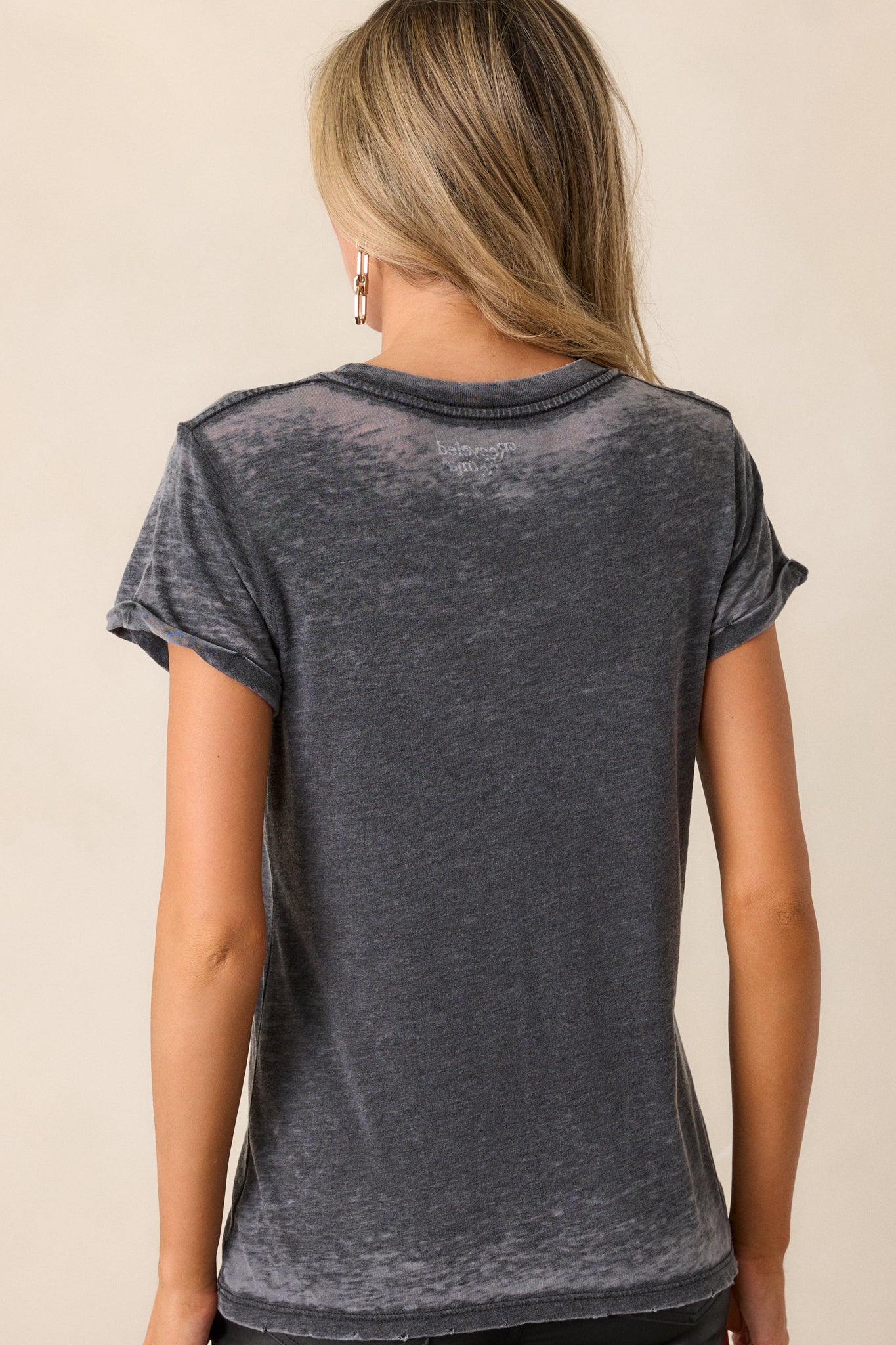 Back view of the tee, showing the clean back with a subtle acid wash effect and a relaxed fit at the hem.