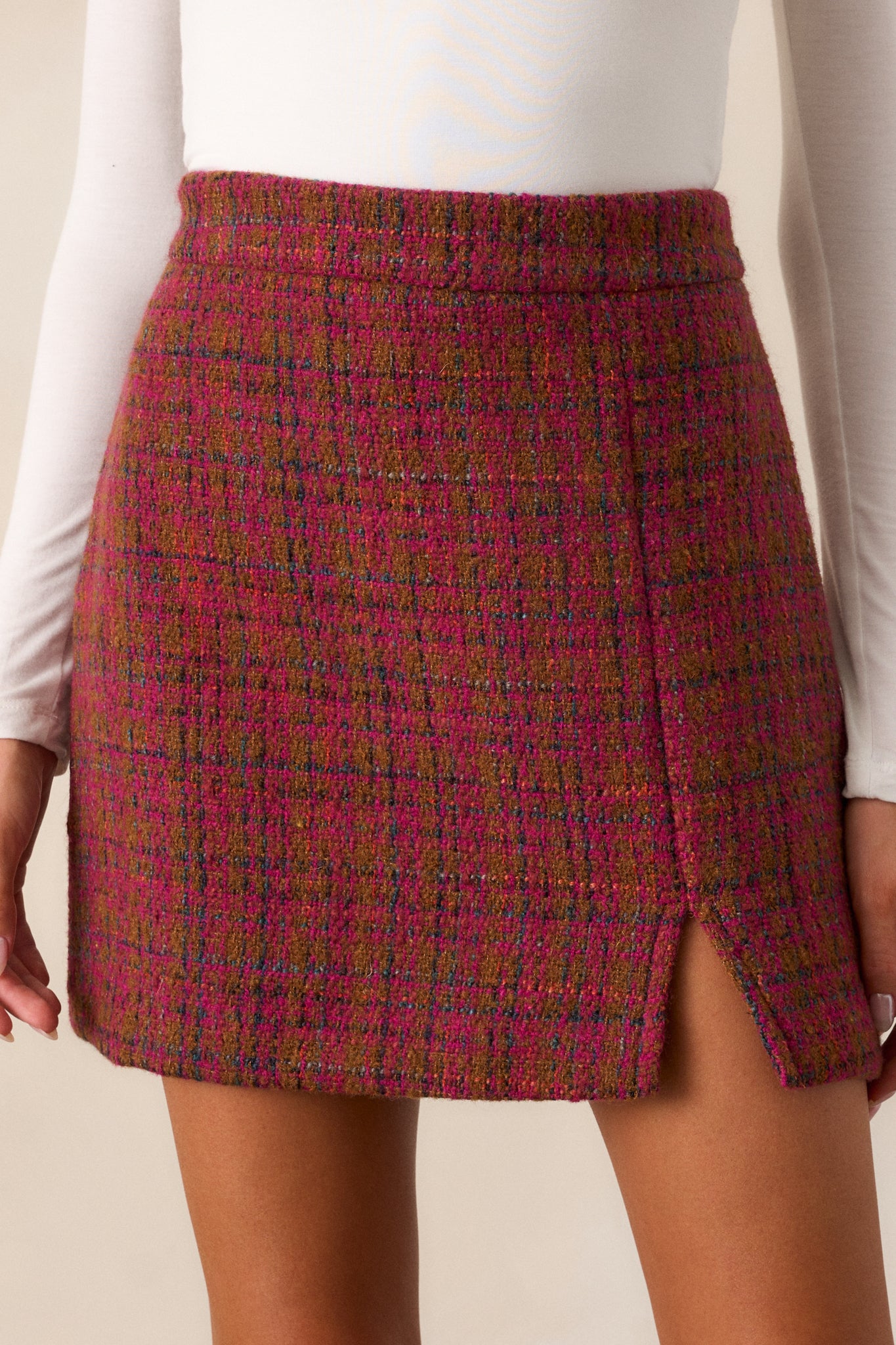 Close-up of the multicolor tweed texture on the dark sangria skirt, emphasizing the vibrant threads within the fabric.