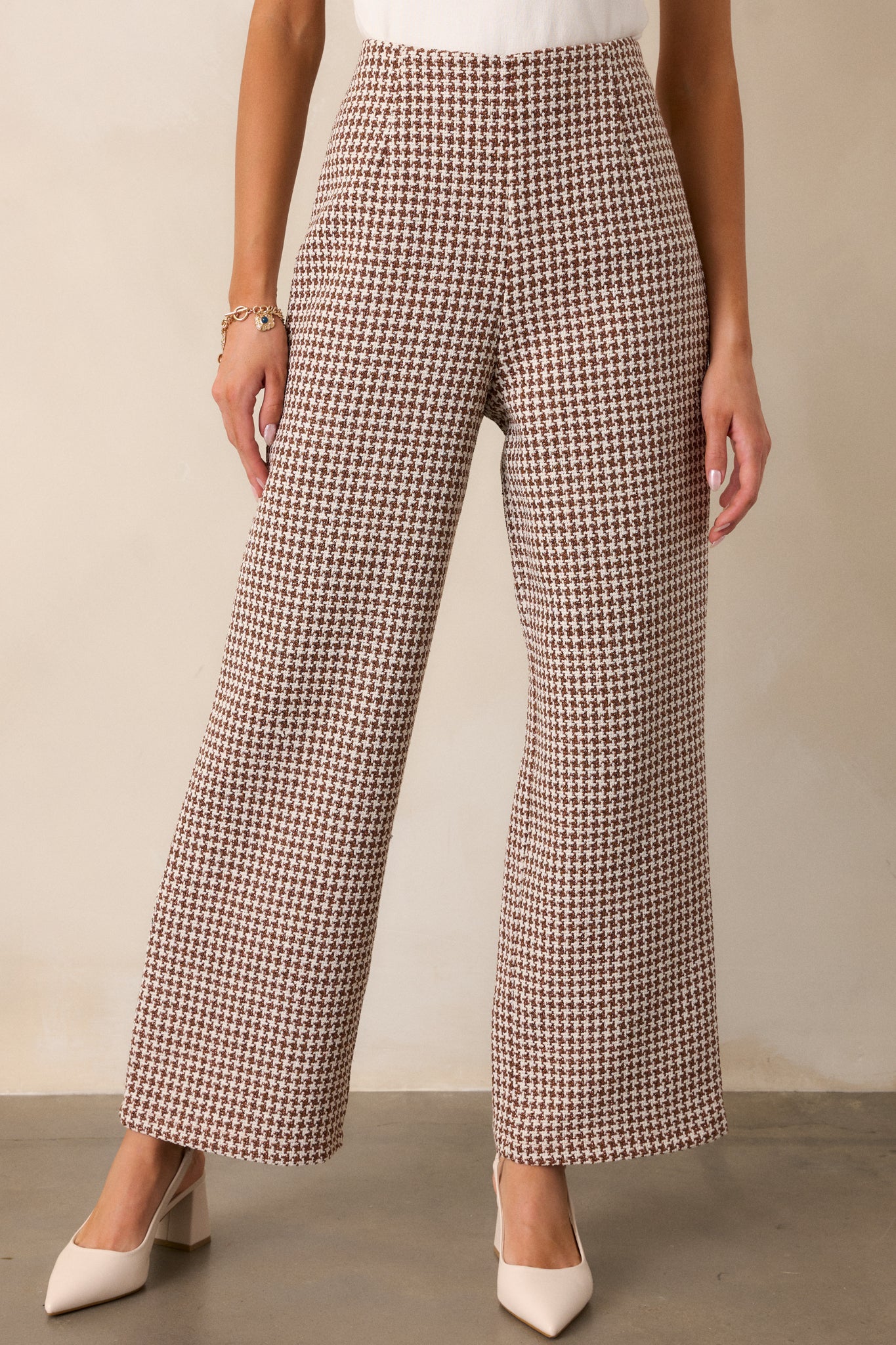 Cropped view showcasing the upper section, highlighting the high waist and detailed houndstooth pattern in ivory and brown.