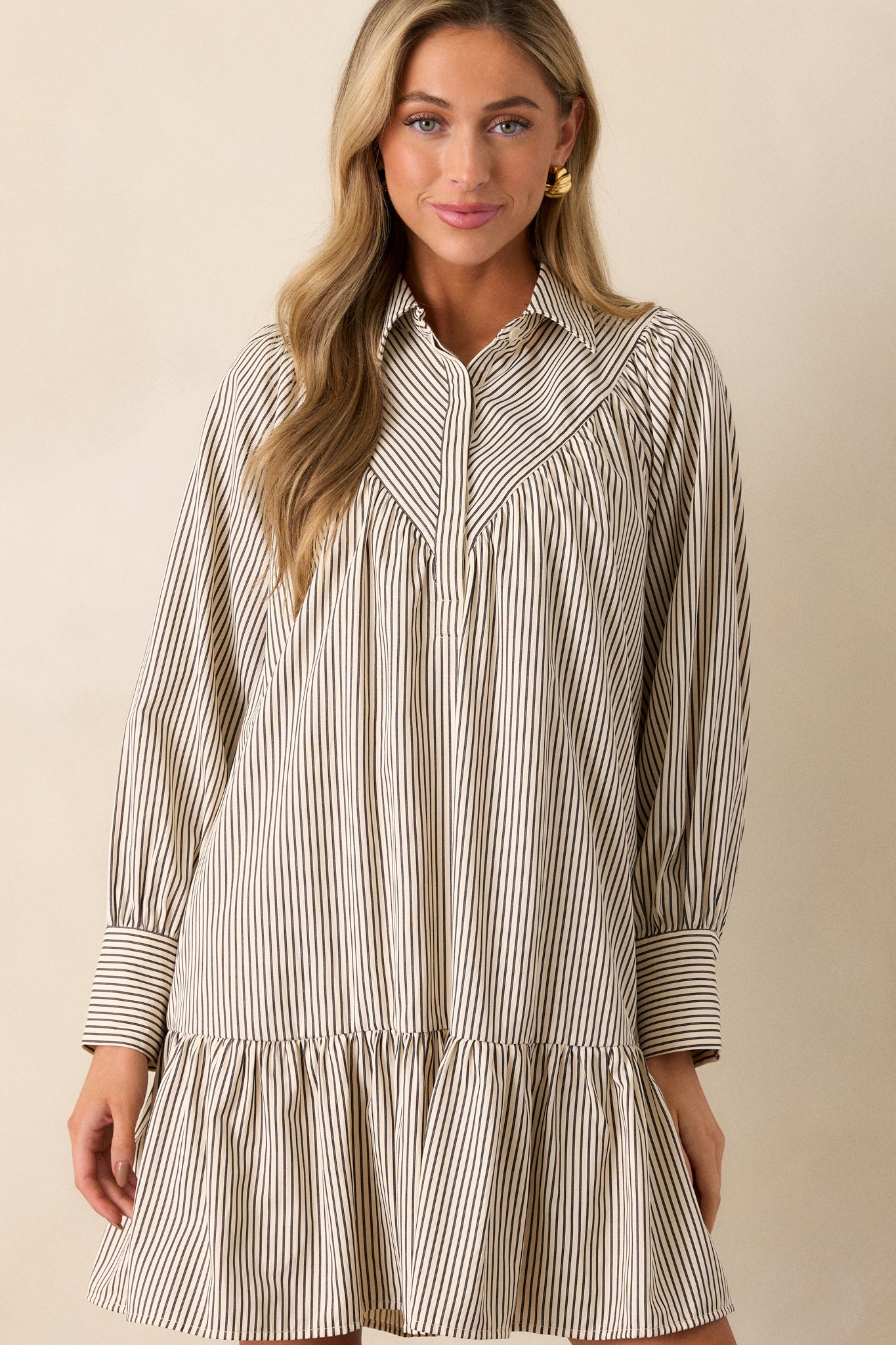 Close-up of the collar and upper section, focusing on the collared neckline, diagonal stripe yoke detailing, and the horizontal stripes across the shoulders.