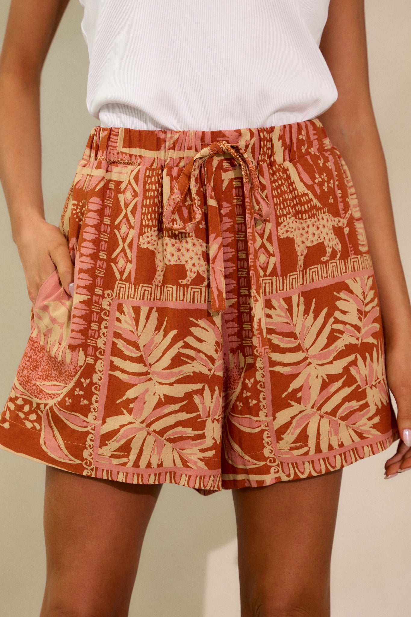 Close-up of the front of the shorts, focusing on the drawstring detail and texture of the fabric.