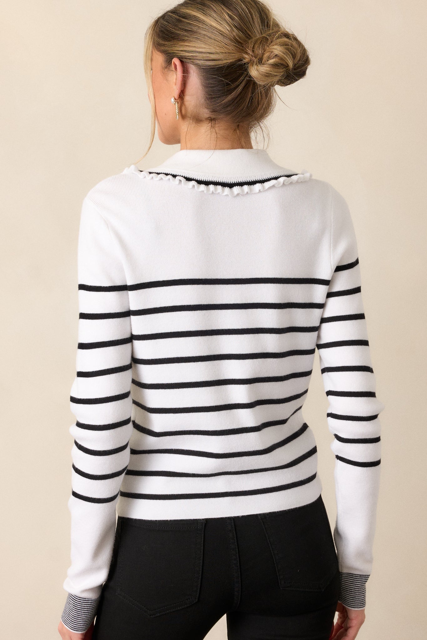 Back view of the cardigan, capturing the striped pattern on the back and the full, structured silhouette of the top.