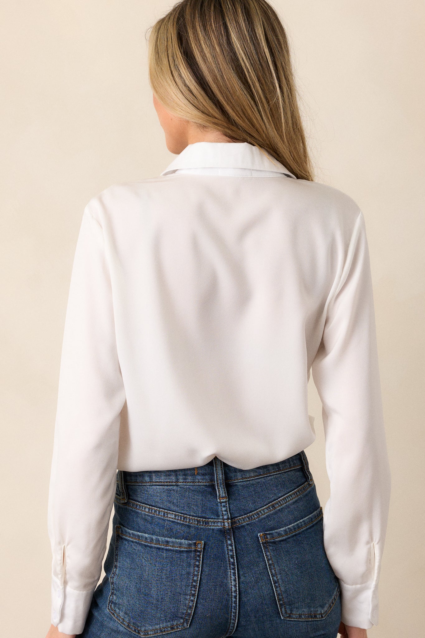 Back view of the bodysuit, showing the clean design, with the snap button closure at the undergarment and the smooth fit of the bodysuit from top to bottom.