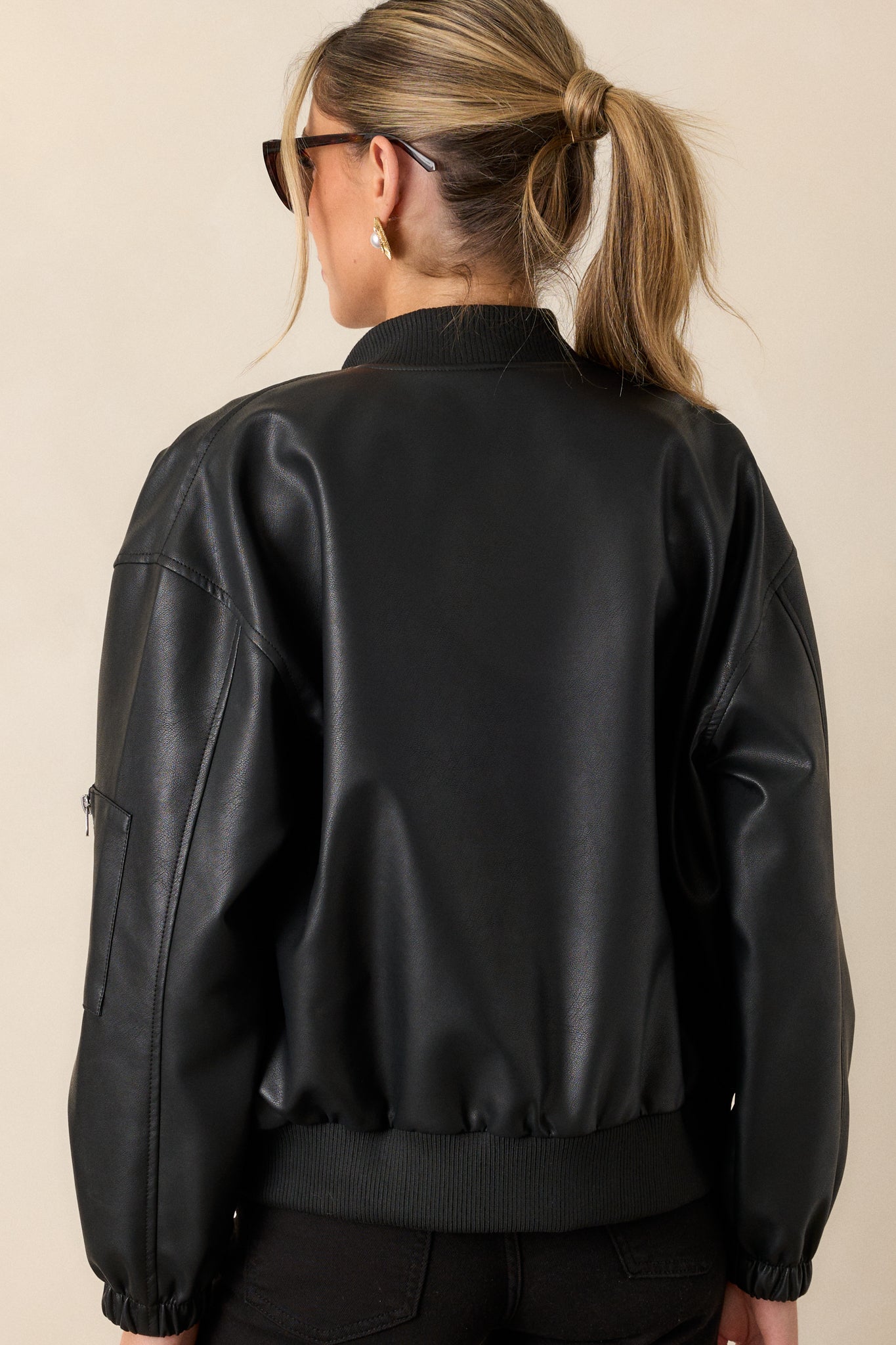 Back view of the jacket highlighting its clean lines and the overall fit, demonstrating the design's practicality and aesthetic appeal.