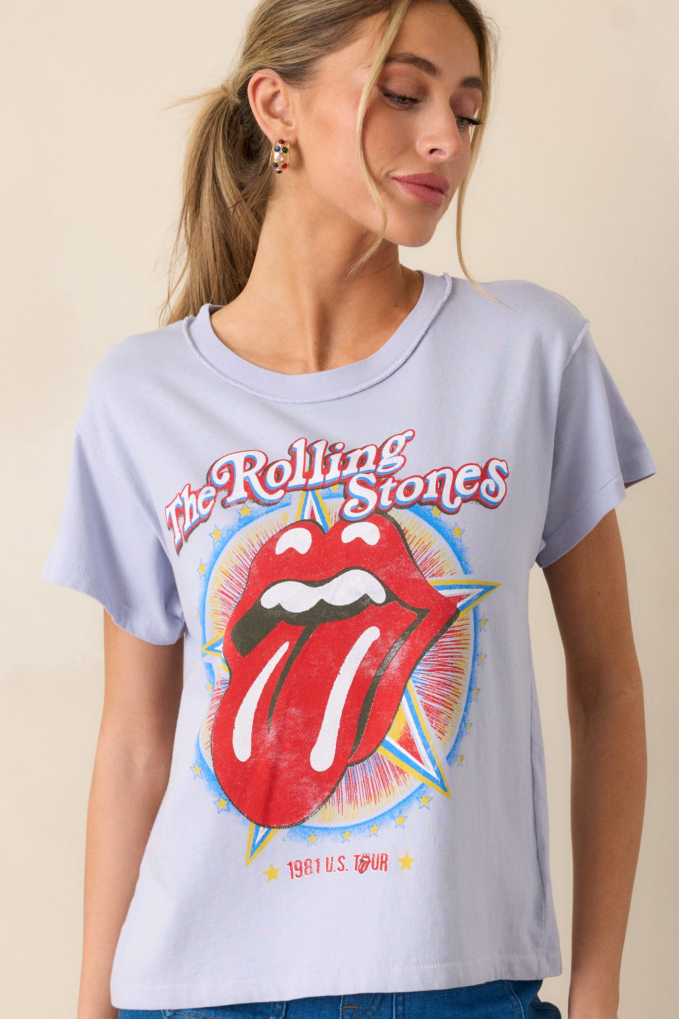 Another front shot highlighting the lavender color of the top. The round neckline and short sleeves frame the bold "Rolling Stones 1981" graphic on the front, emphasizing the casual, retro style.