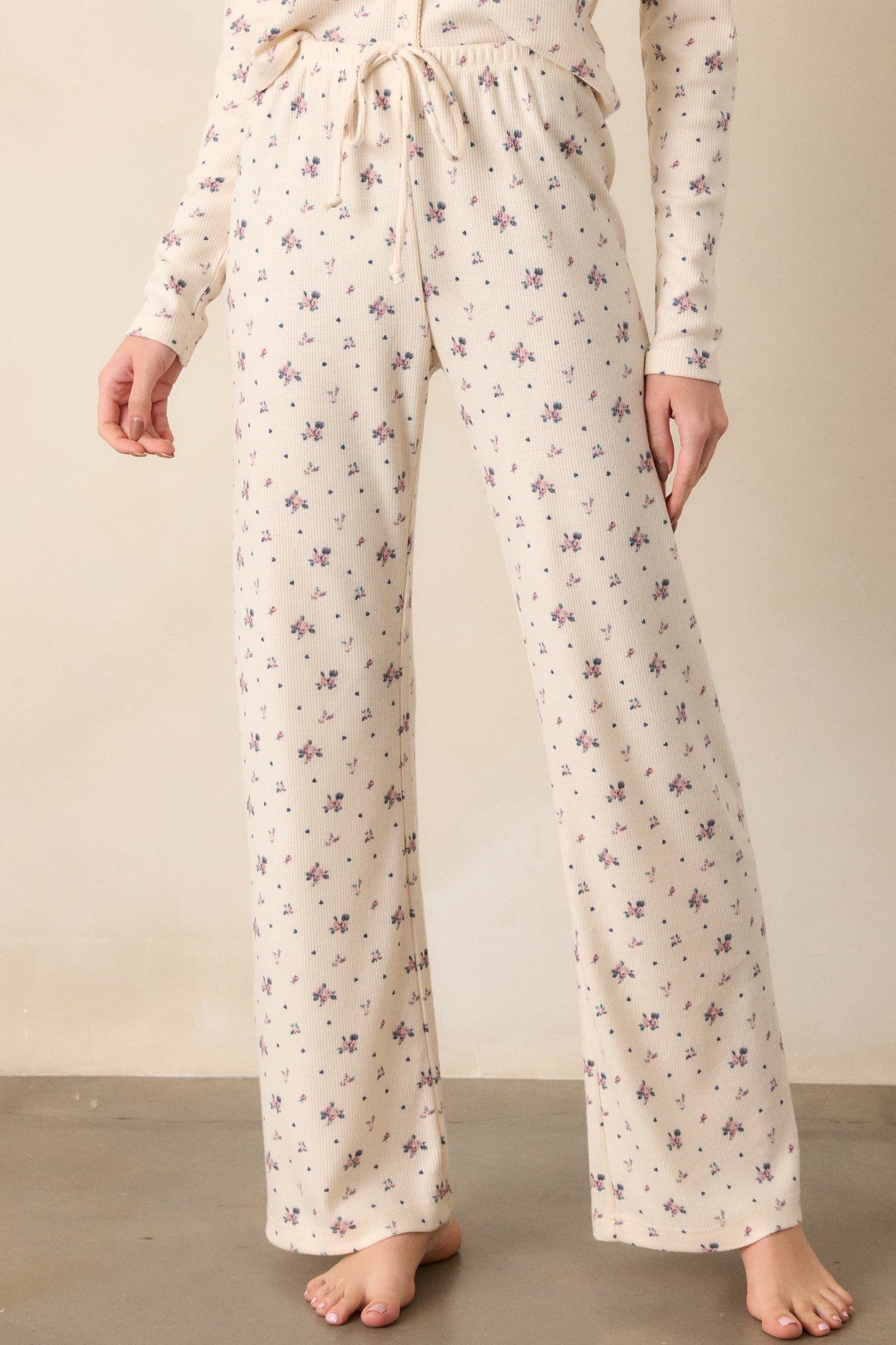 Cropped image focusing on the waistband of the lounge pants, emphasizing the adjustable drawcord and the soft fabric texture.