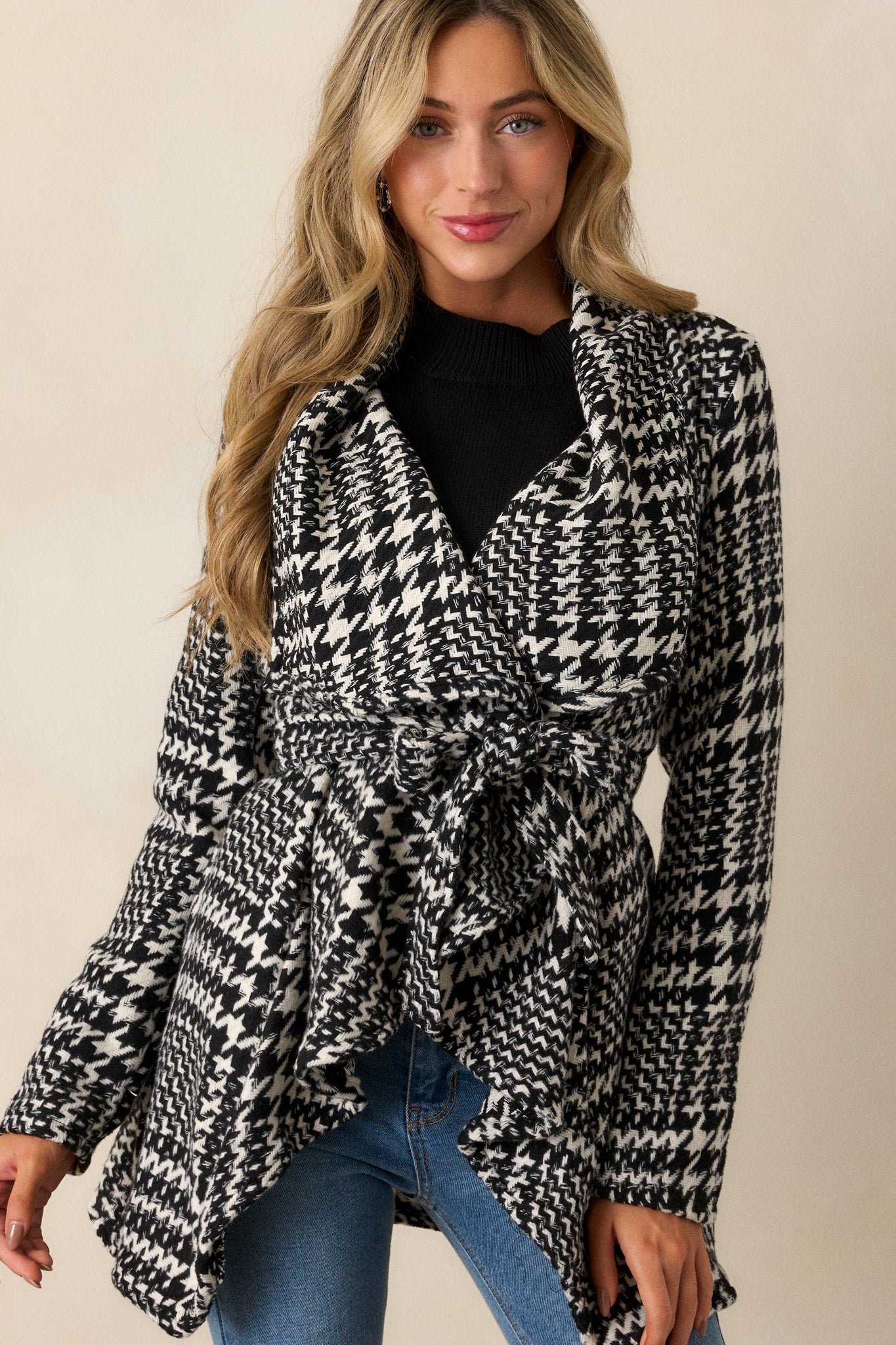 Close-up of the collar area, focusing on the houndstooth pattern and the texture of the soft material.