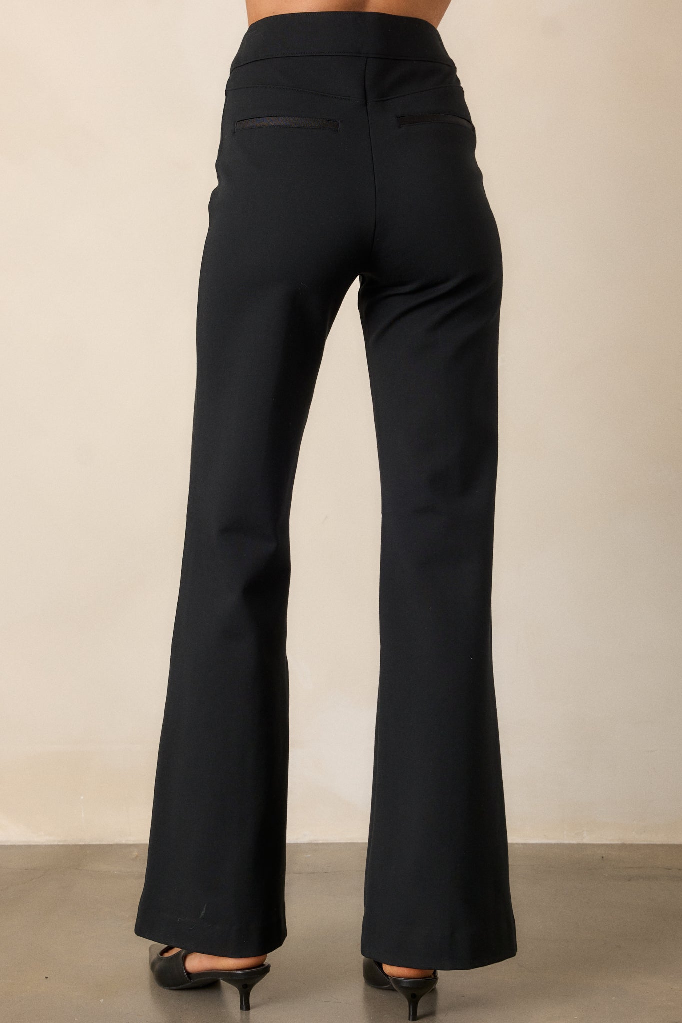 Back view of the pants showcasing the fit at the back, highlighting the seamless design and how it conforms to the body’s shape.