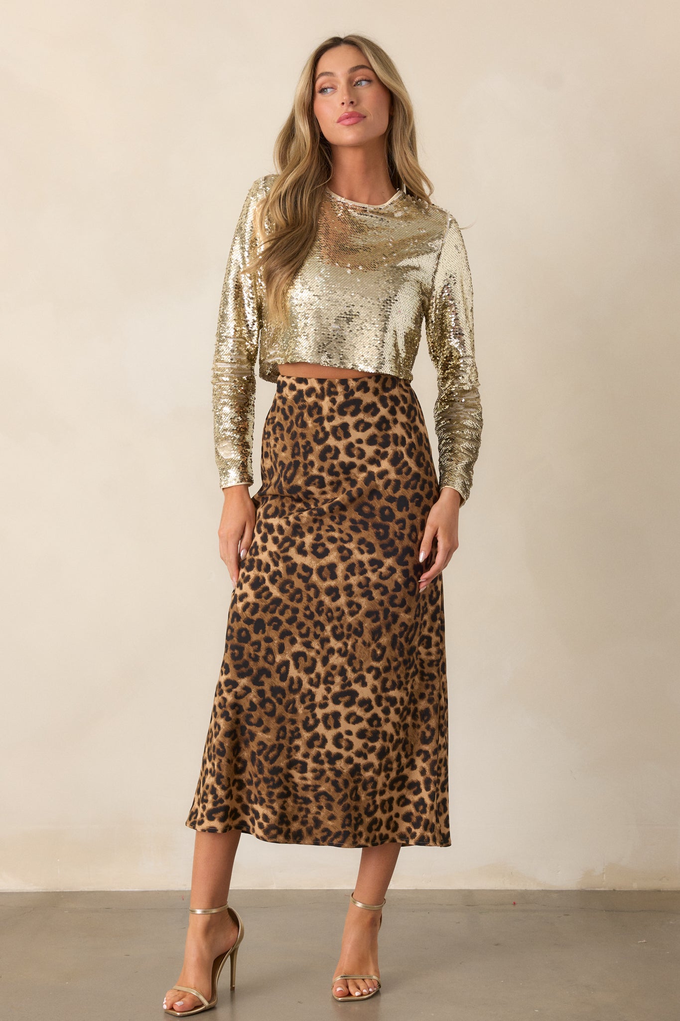 Full-length view of the leopard print skirt, showcasing the midi length and classic A-line shape.