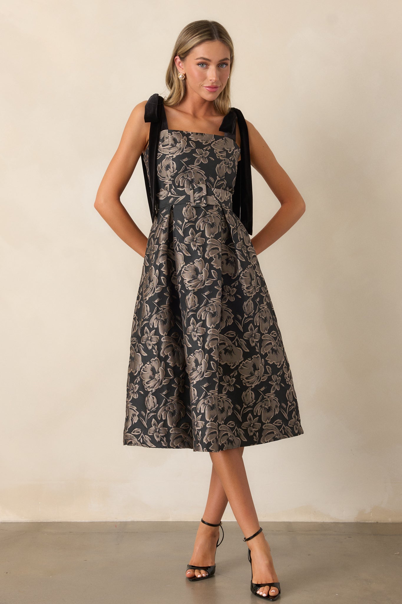 A full-length view capturing the silhouette of the dress and the subtle sheen of the jacquard fabric.