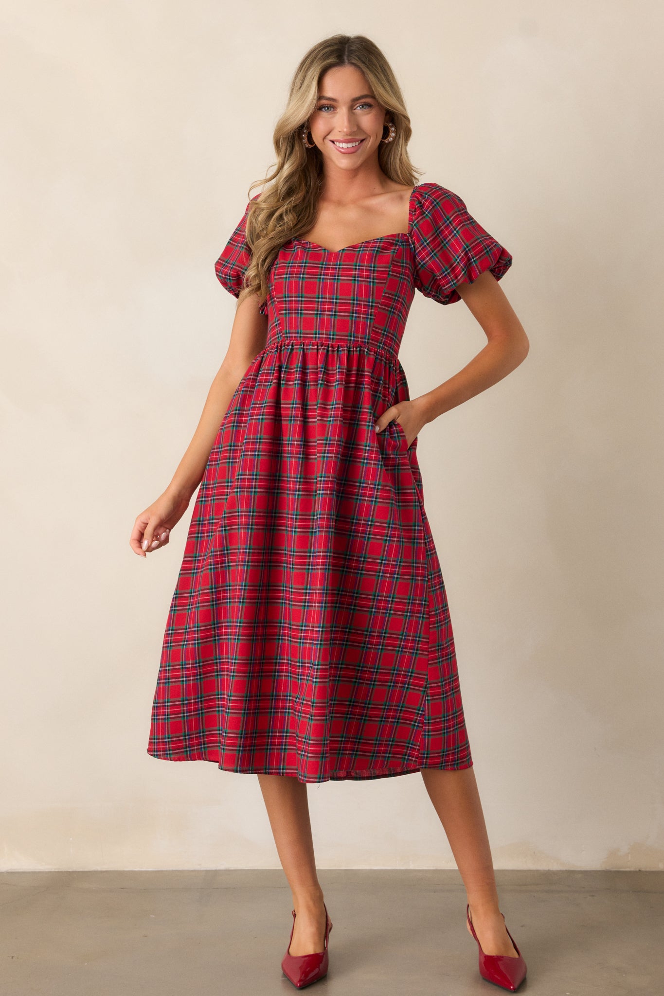 Full-length view from the front, focusing on the structured fit, puff sleeves, and plaid design.