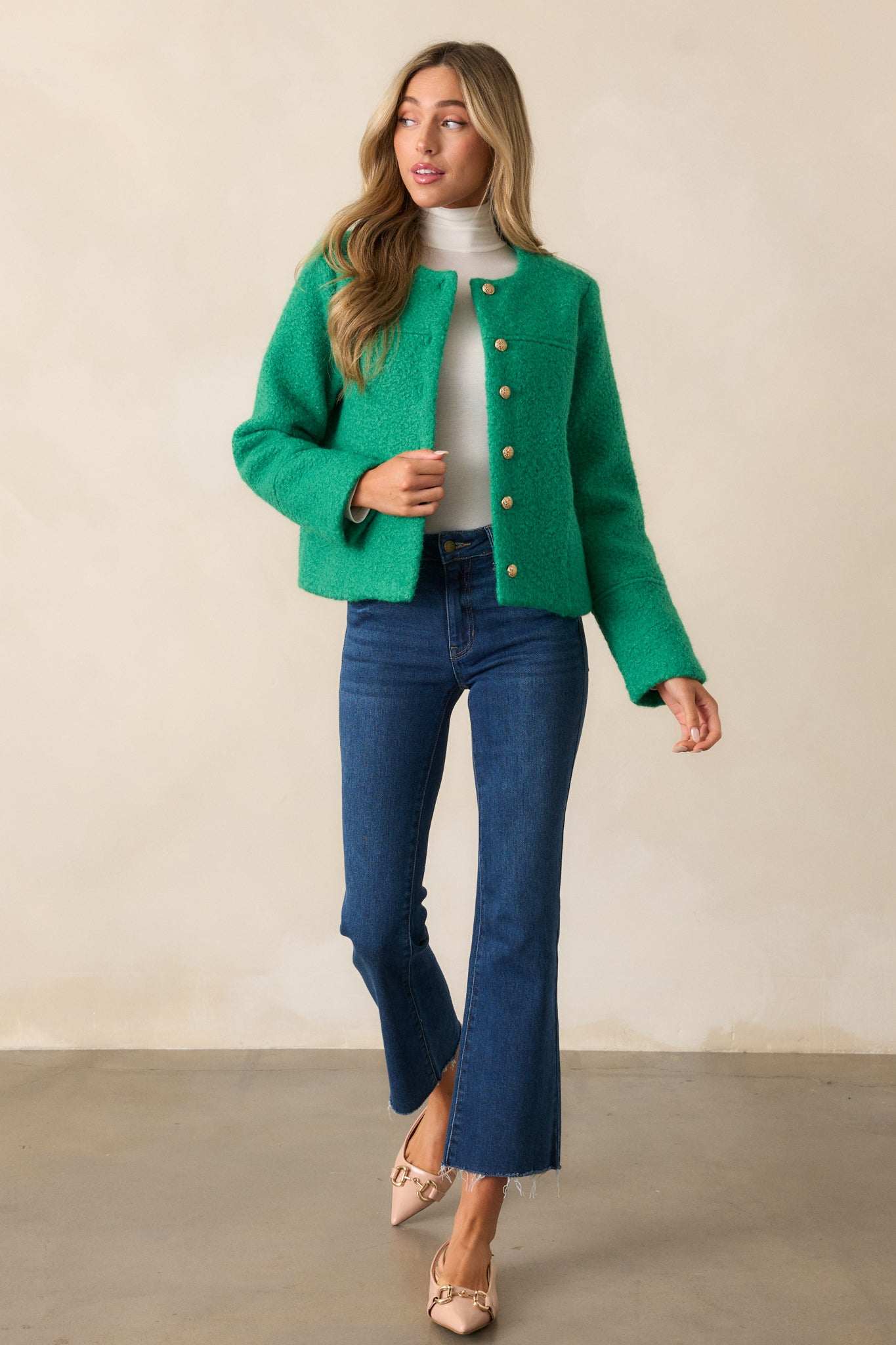 Full-length view of the kelly green jacket emphasizing the structured fit and button detailing.