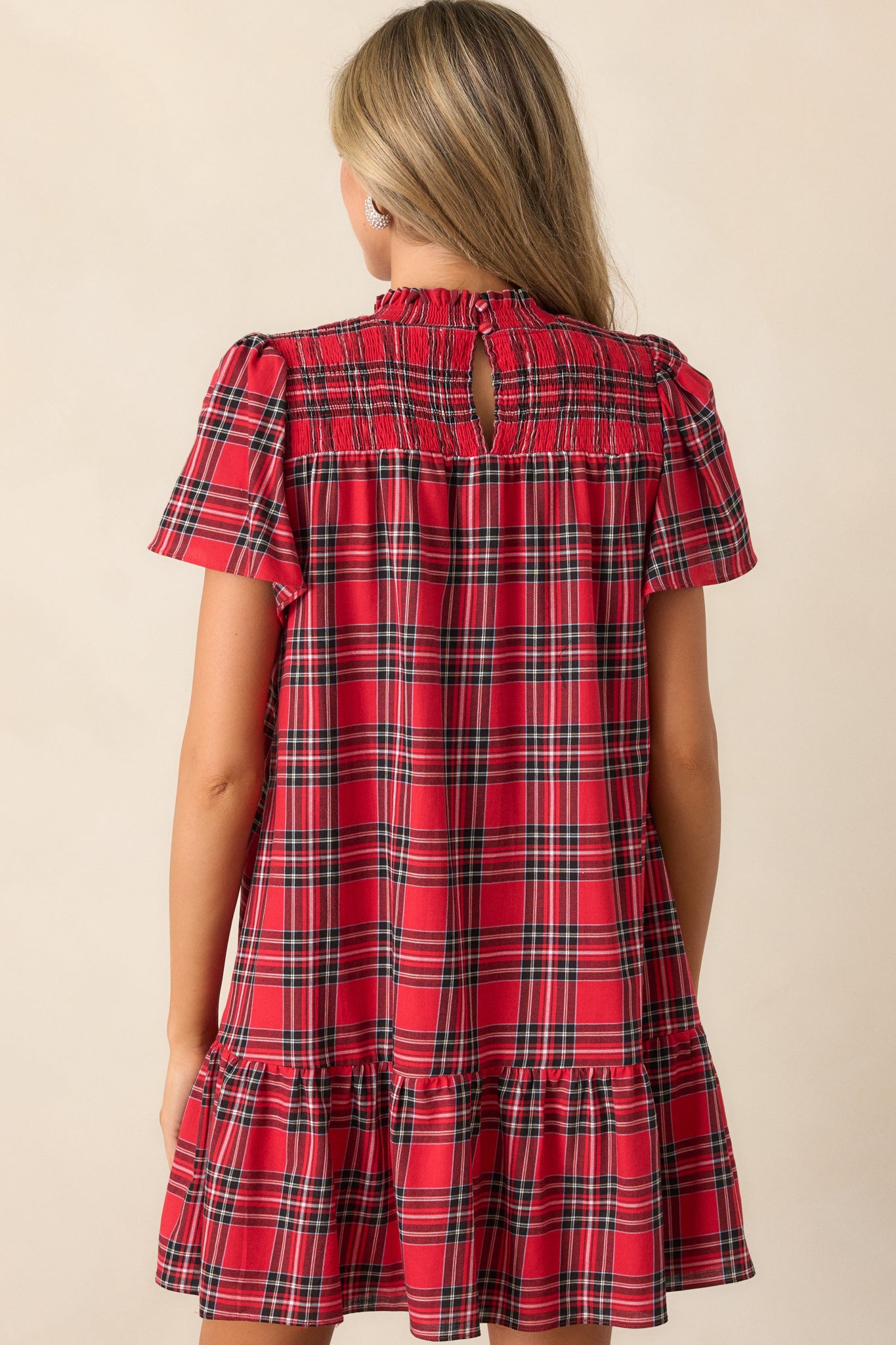 Full back view of the dress, showing the plaid print and the placement of the keyhole closure.