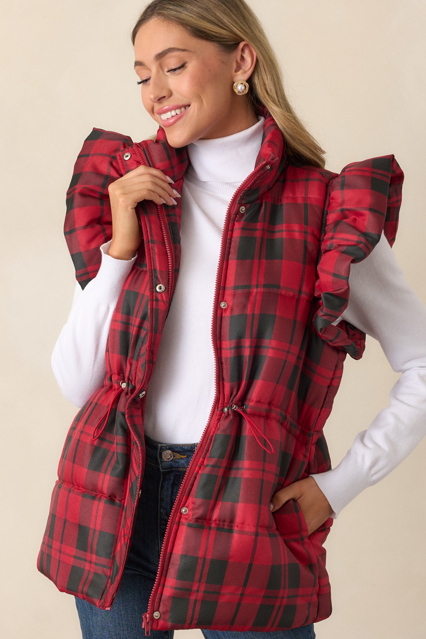 Close-up of the upper bodice showing the collared neckline, plaid fabric, and fluffy flutter sleeves.