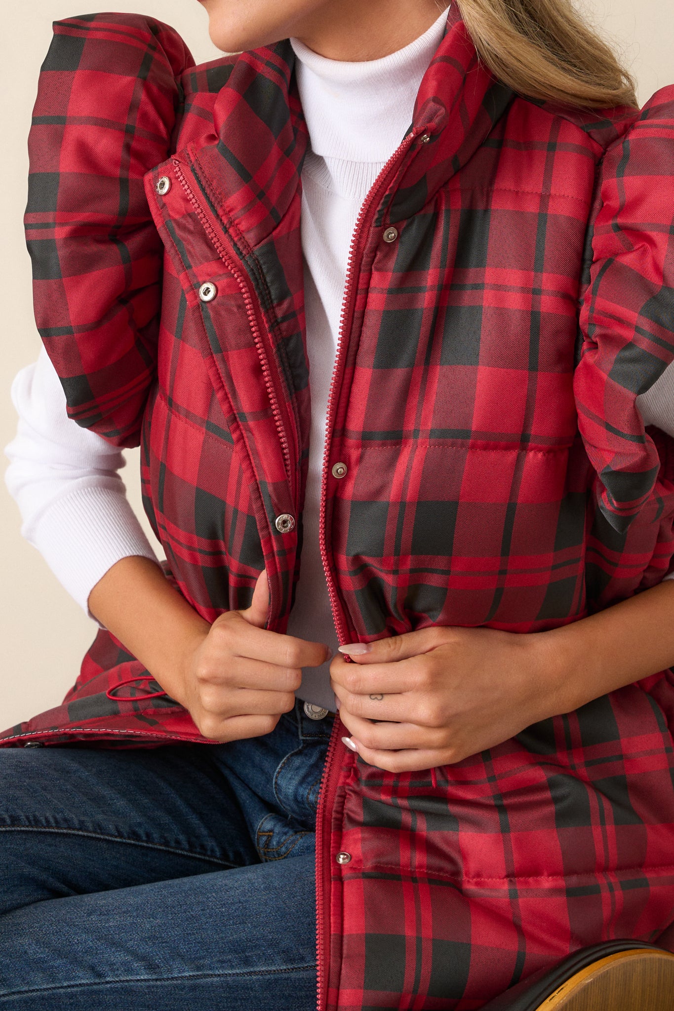 Zoomed-in view of the drawstring cinch waist detailing and silver hardware at the midsection of the vest.