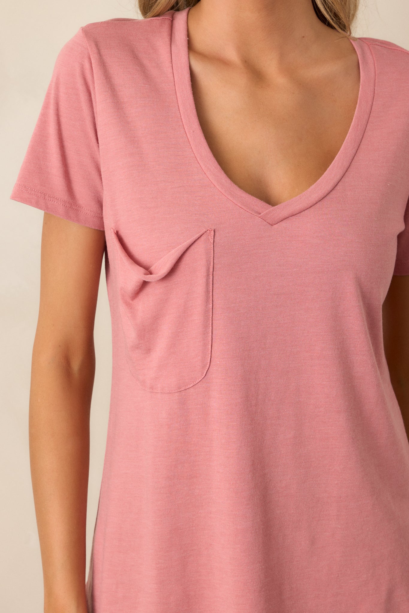 Close-up of the rosebud tee showing the v-neckline, functional chest pocket, and the texture of the super soft fabric.