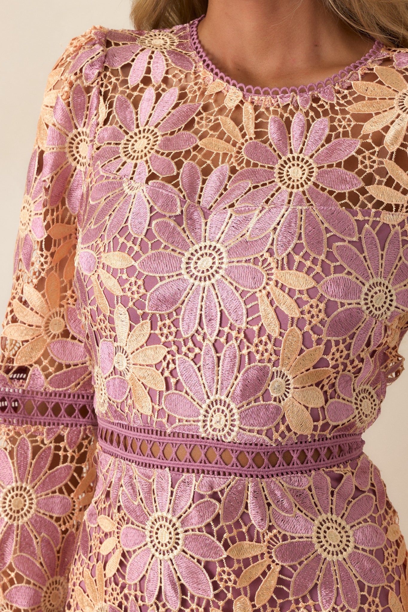 A zoomed-in look at the floral overlay texture, showcasing the intricate detailing and fabric's delicate camel hue.