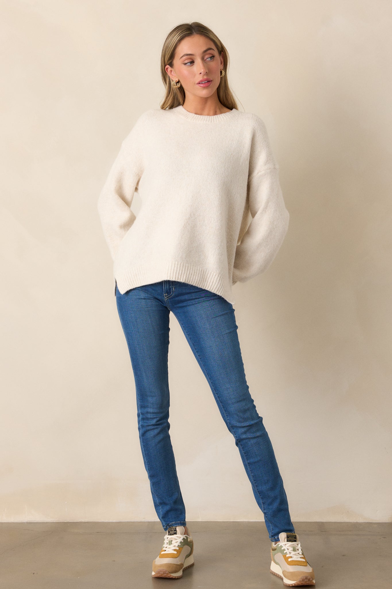 The sweater shown from a front view, highlighting its relaxed fit and fun look with a comfortable silhouette.