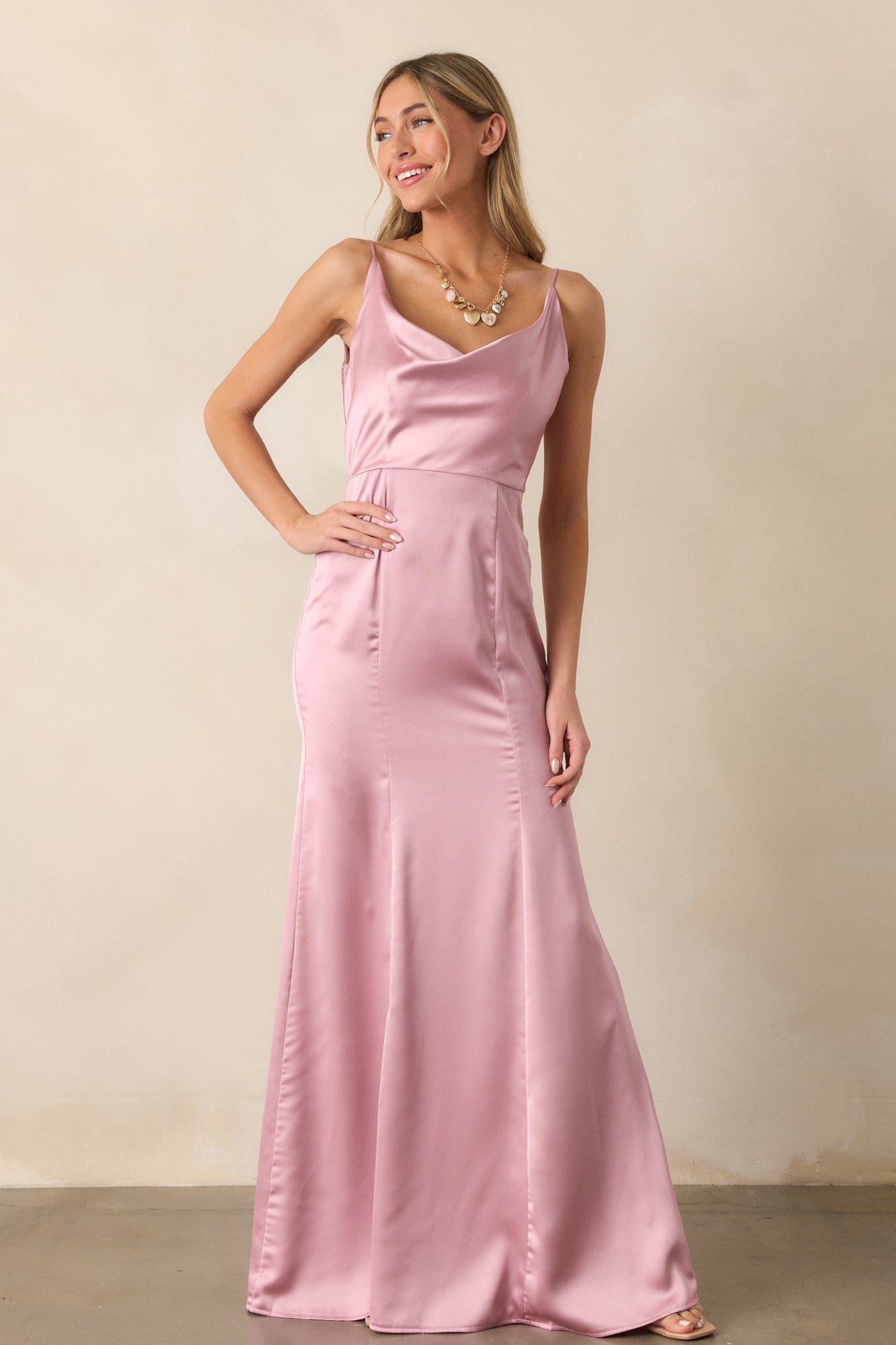 A front-facing image of the blush maxi dress, showcasing the delicate straps and softly structured draped neckline.