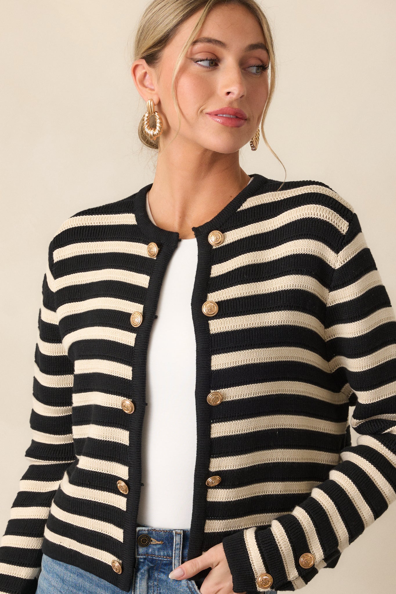 Zoomed-in shot of the cardigan’s midsection, highlighting the striped design and intricate texture of the fabric.