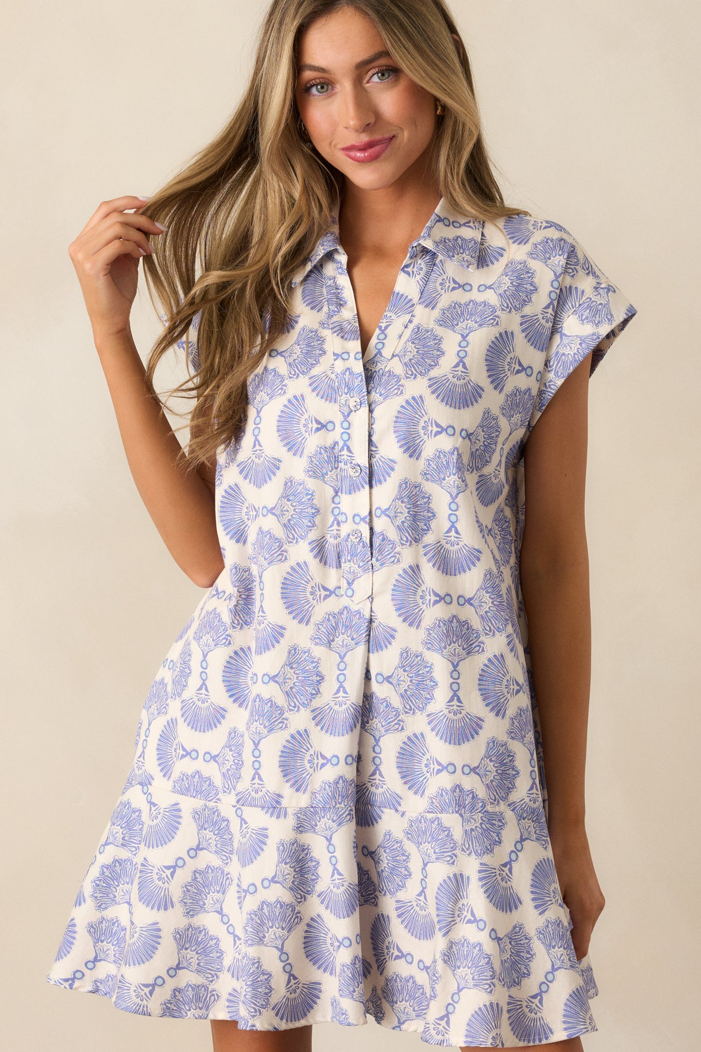 Cropped view of the upper section of the Dusty Blue dress focusing on the structured collared V-neck and cap sleeves.