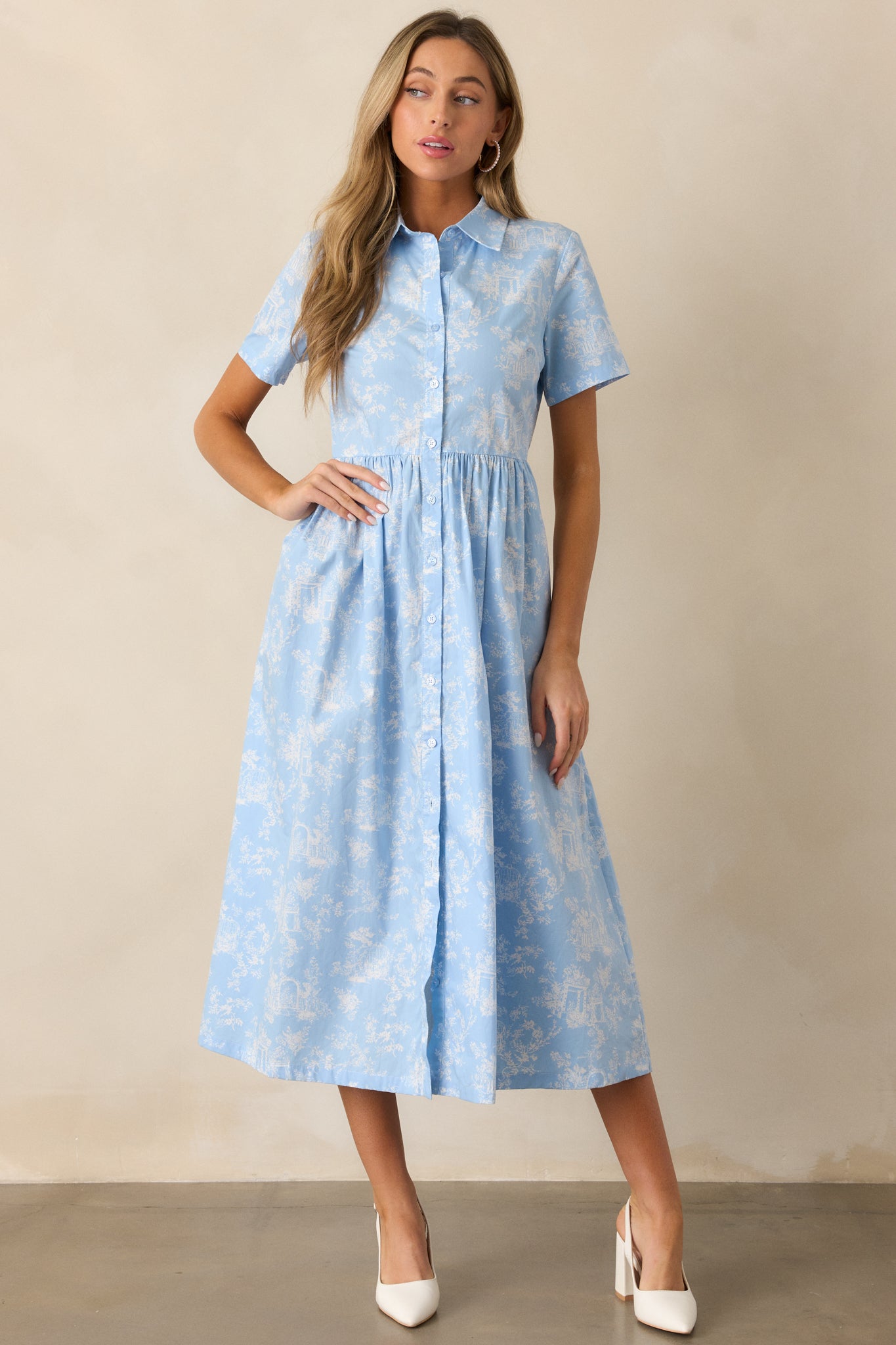 The light blue maxi dress is displayed with its button front detail and elegant flowing silhouette.