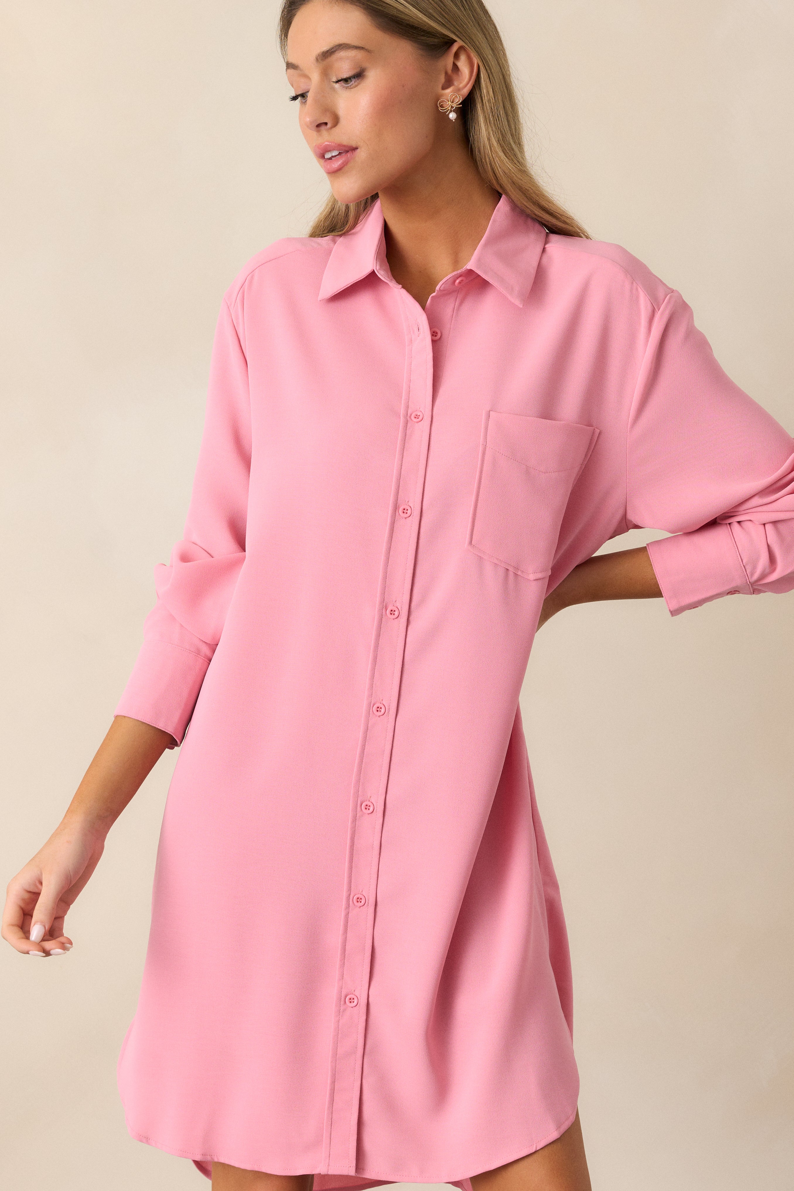 Focused image of the side slits on the pink dress, showing the clean lines and subtle detailing.