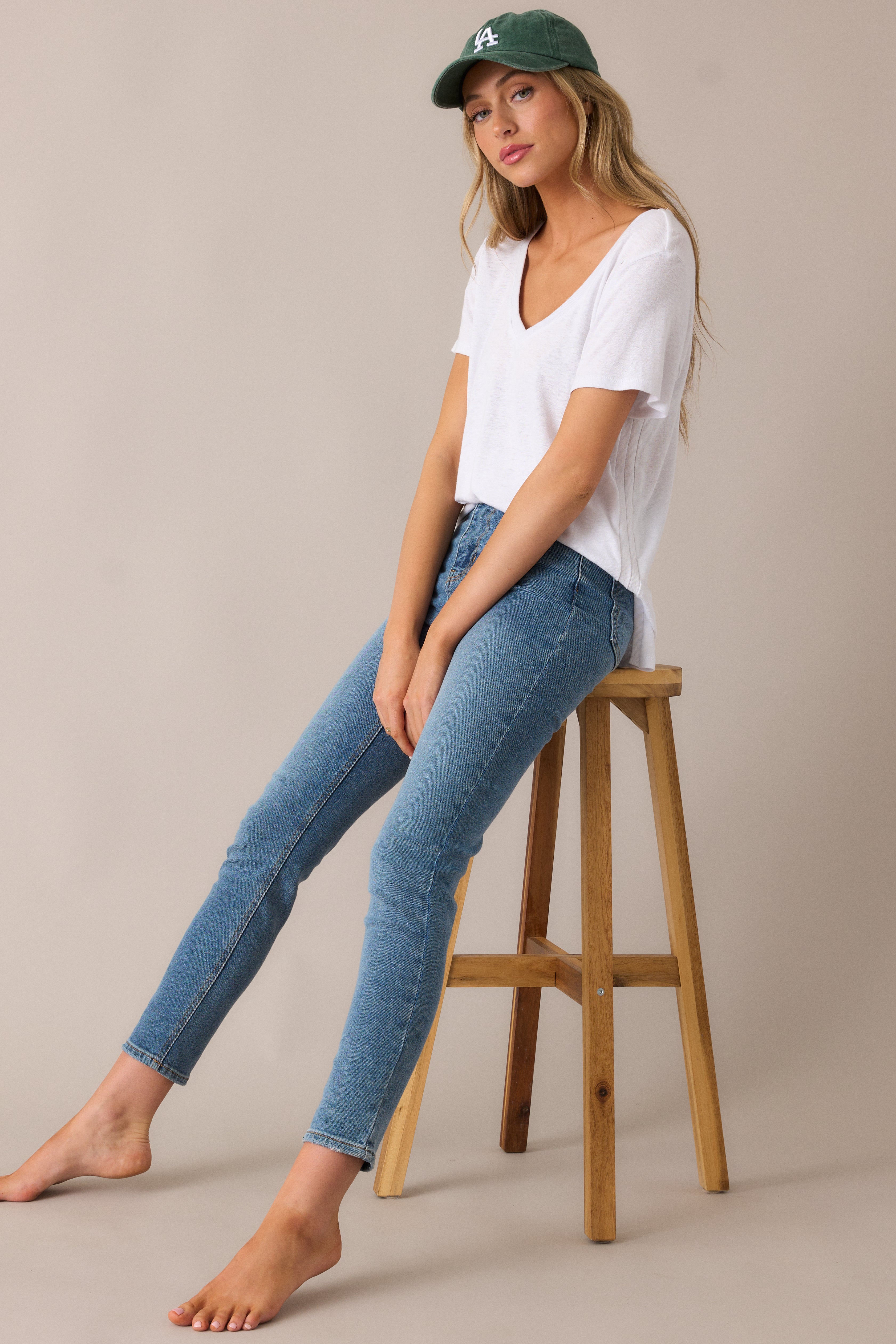 These medium-wash jeans highlight the slim, figure-hugging skinny fit and functional belt loops, designed for a flattering and versatile look.