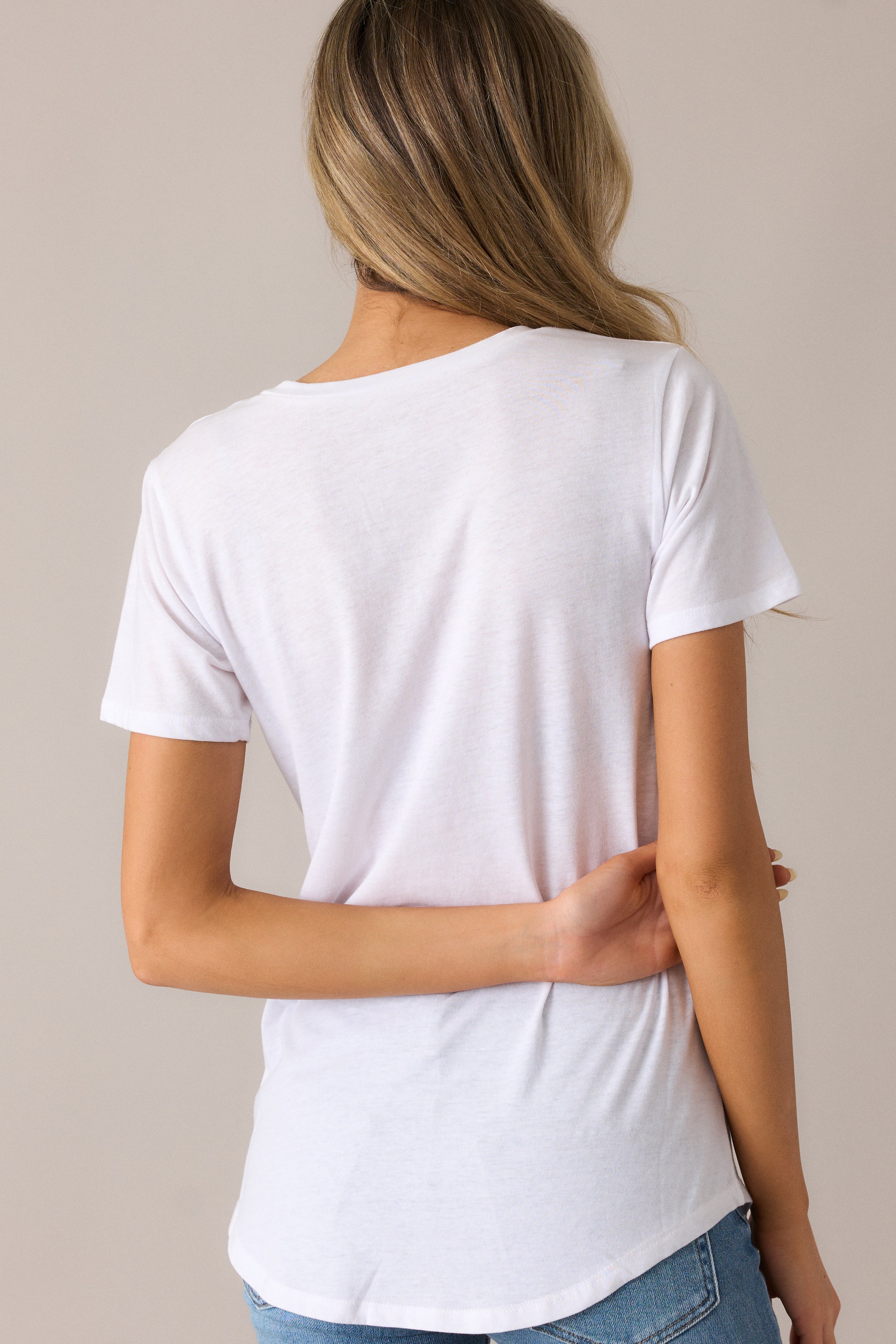 The burnout jersey tee from the back, showcasing the relaxed fit and smooth scoop hemline, perfect for everyday wear.