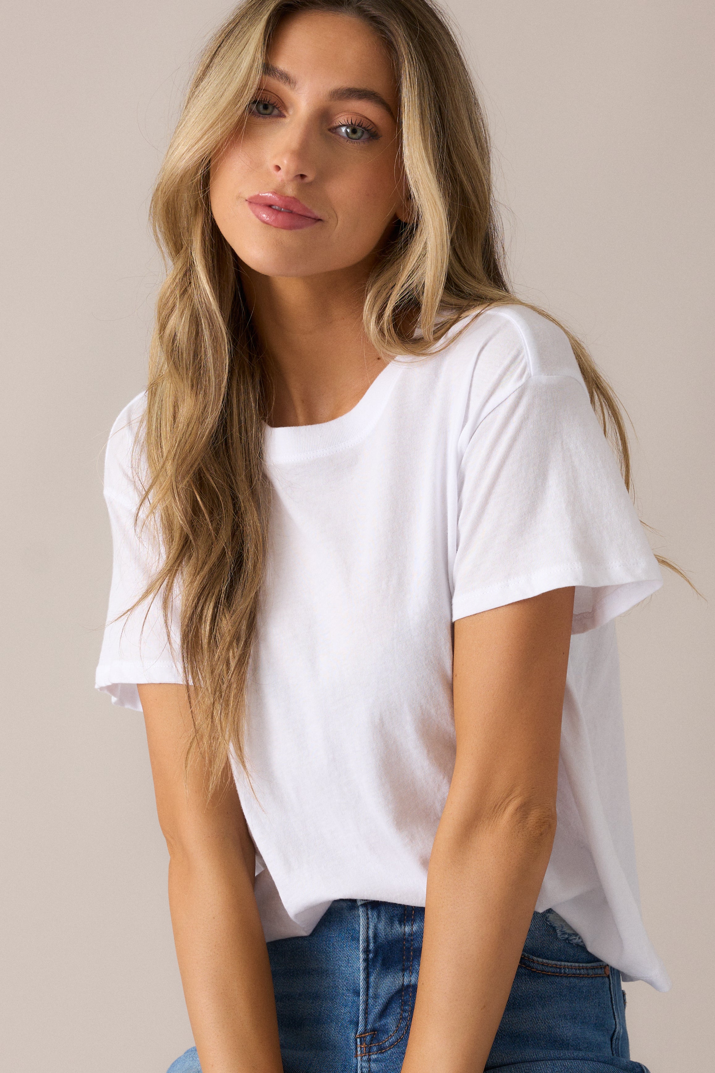 Focused shot on the short sleeves and relaxed body of the tee, showing off its effortless, flattering fit and laid-back vibe.