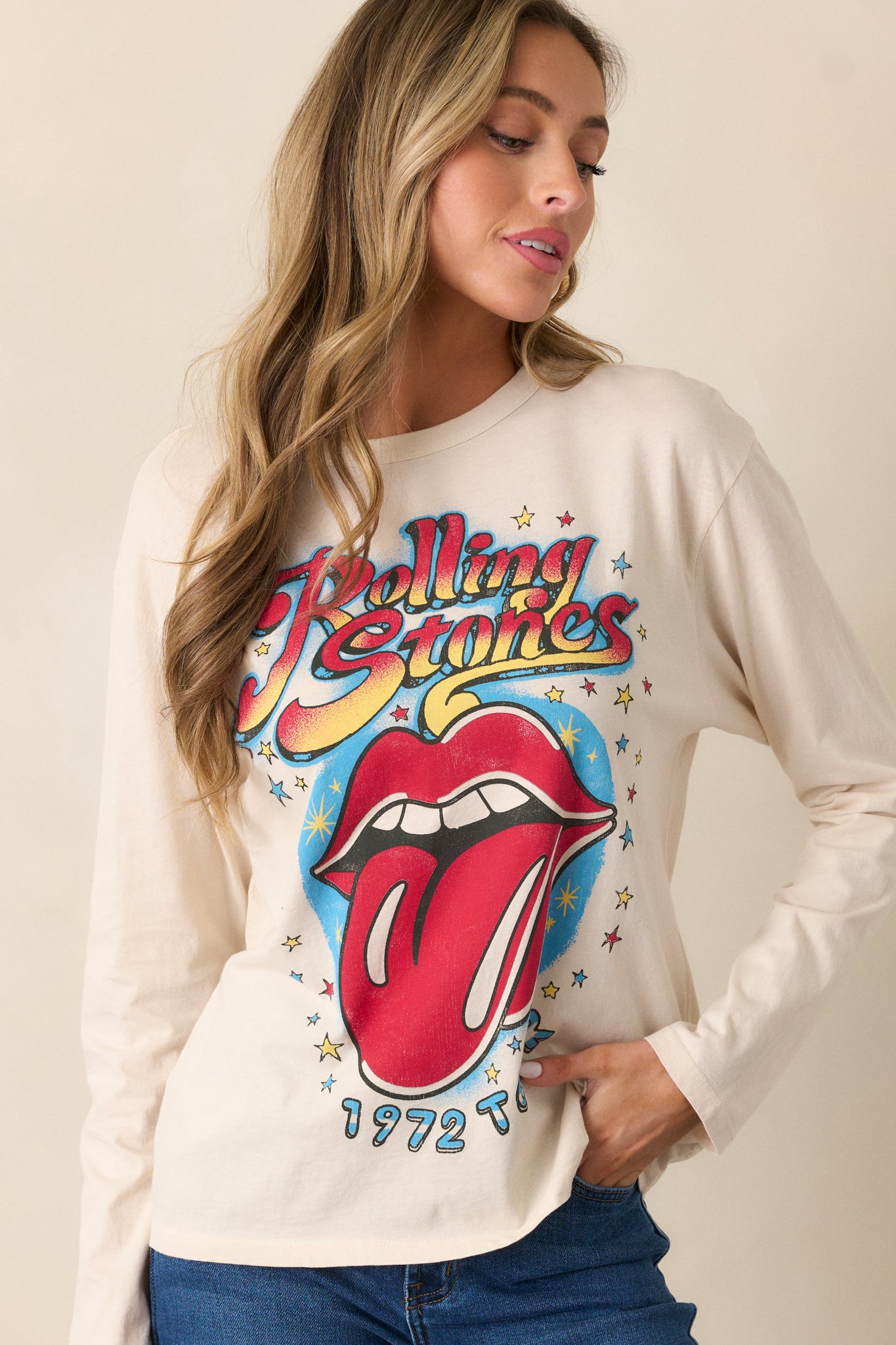 A relaxed-fit ecru long sleeve tee, highlighted by the iconic Rolling Stones 1972 Tour logo and classic crew neck design.