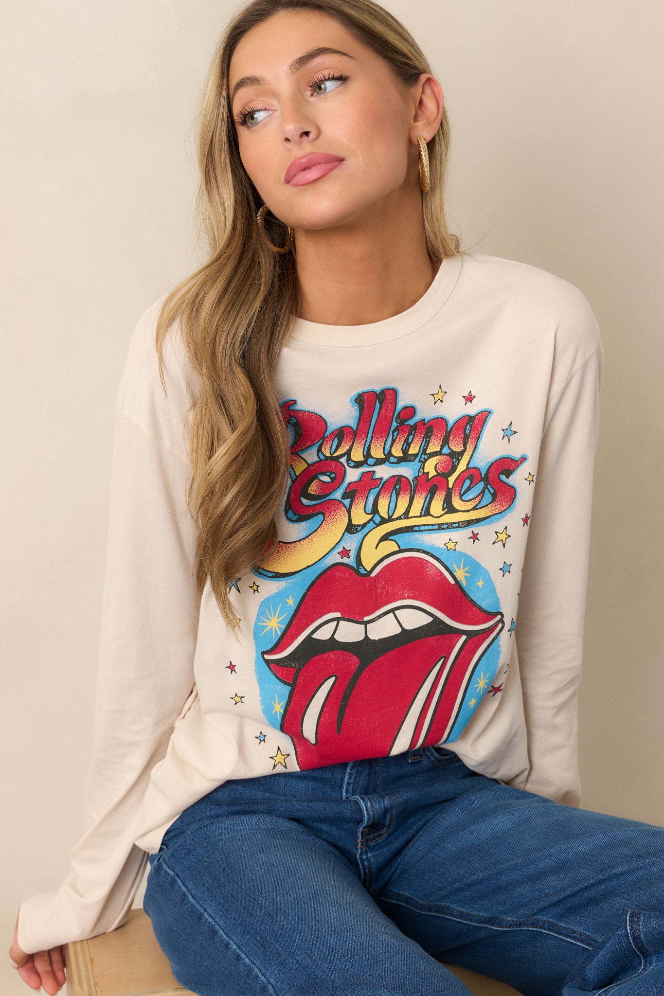 A focused view of the Rolling Stones 1972 Tour logo on the front of the ecru long sleeve tee, emphasizing its graphic detail.