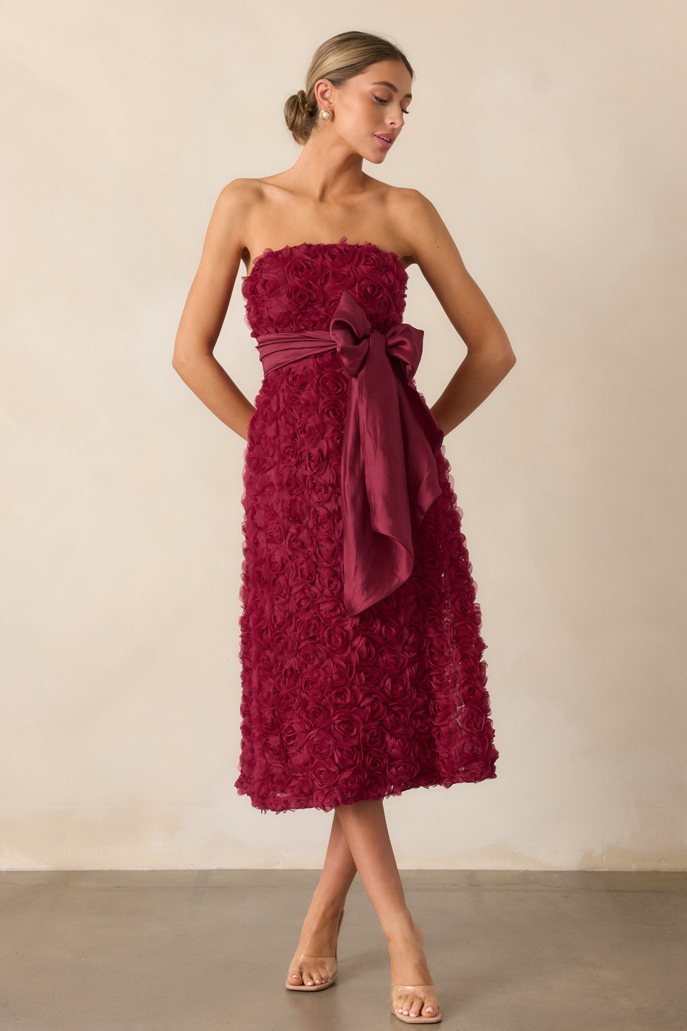 A complete view of the wine dress, focusing on the intricate floral applique and the flattering shape created by the fitted bodice and flowing skirt.