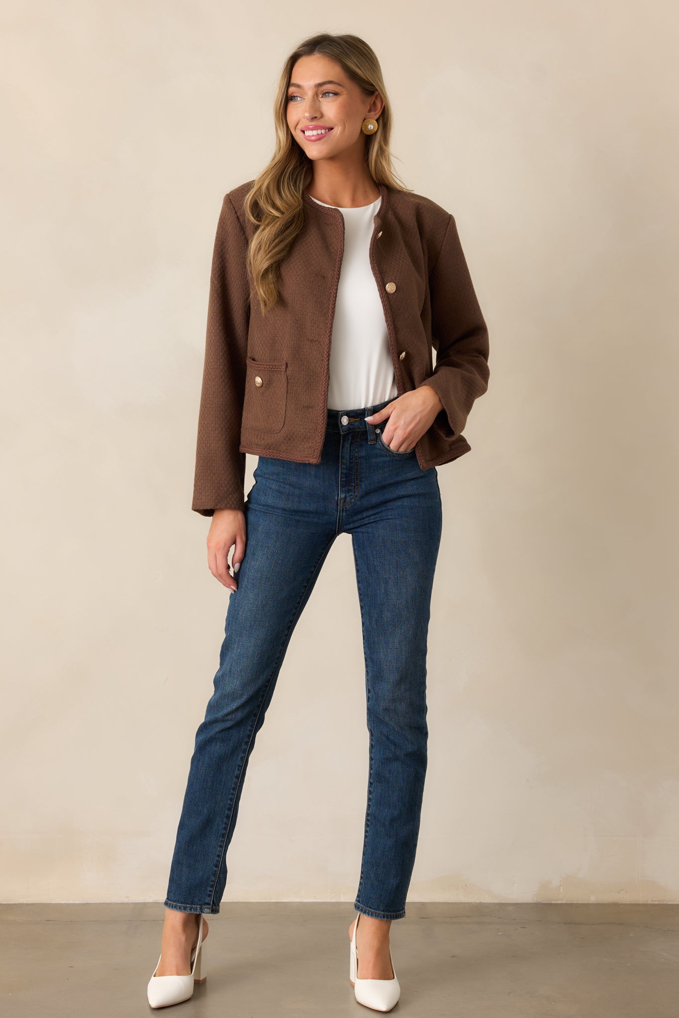 Front-facing full-body image highlighting the functional button front, optional braided waist belt, and two functional waist pockets of the chocolate brown jacket.