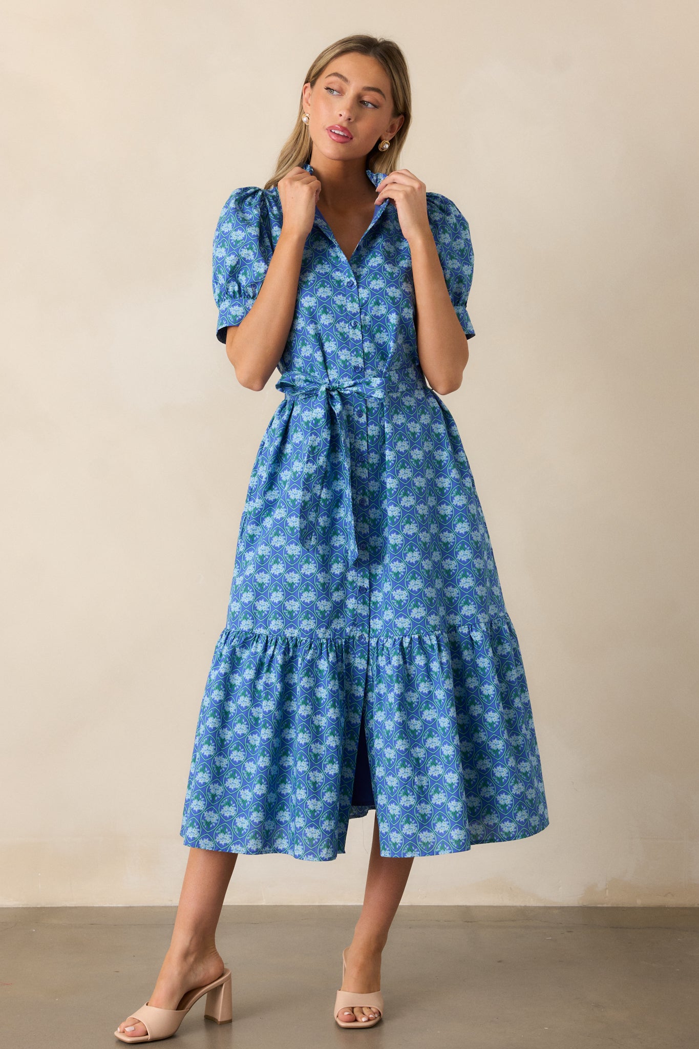 The blue dress in a full-body shot, focusing on the tiered skirt, midi length, and self-tie waistband.