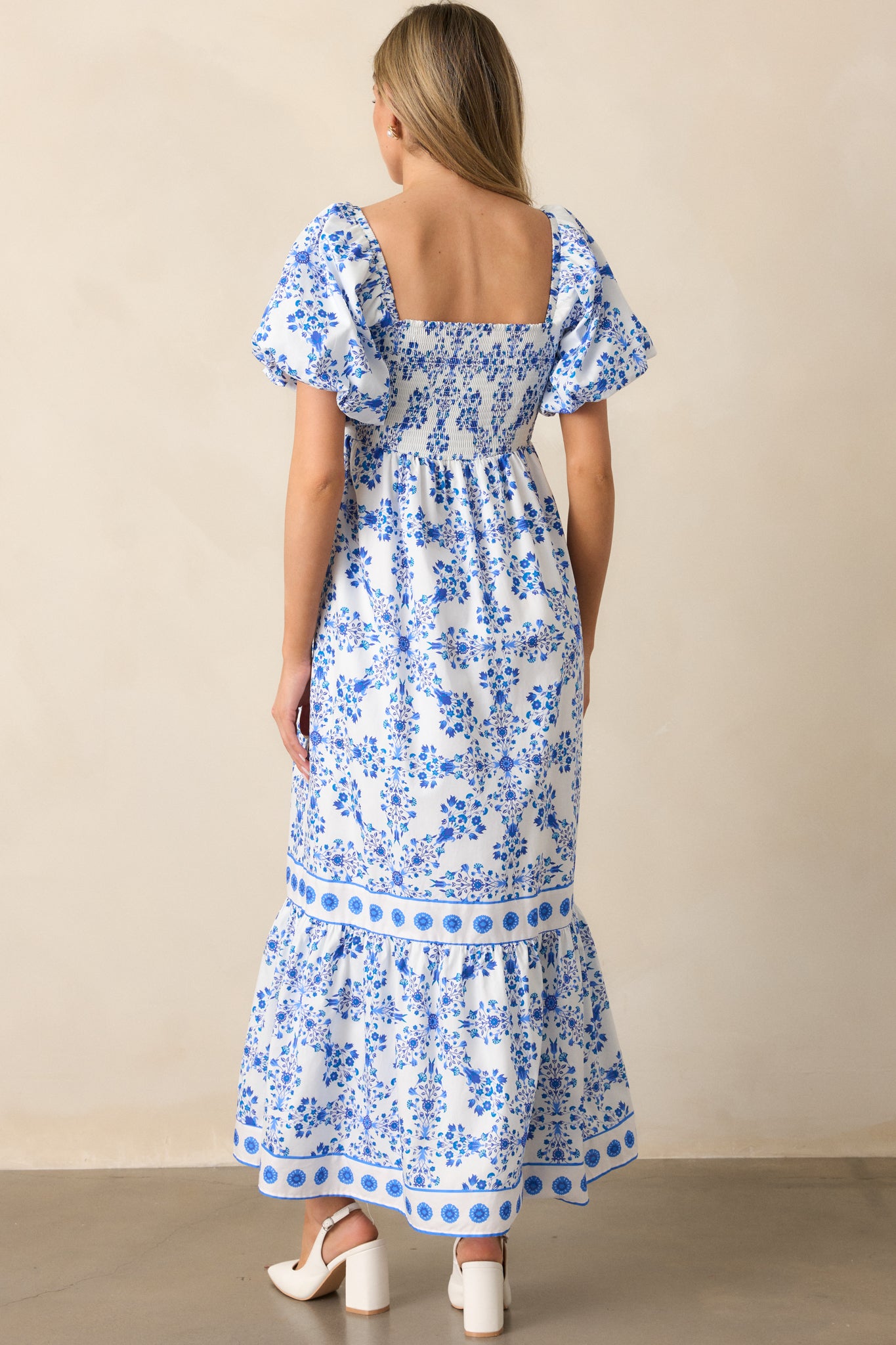 A back view of the royal blue maxi dress, showcasing the relaxed fit and short puff sleeves.