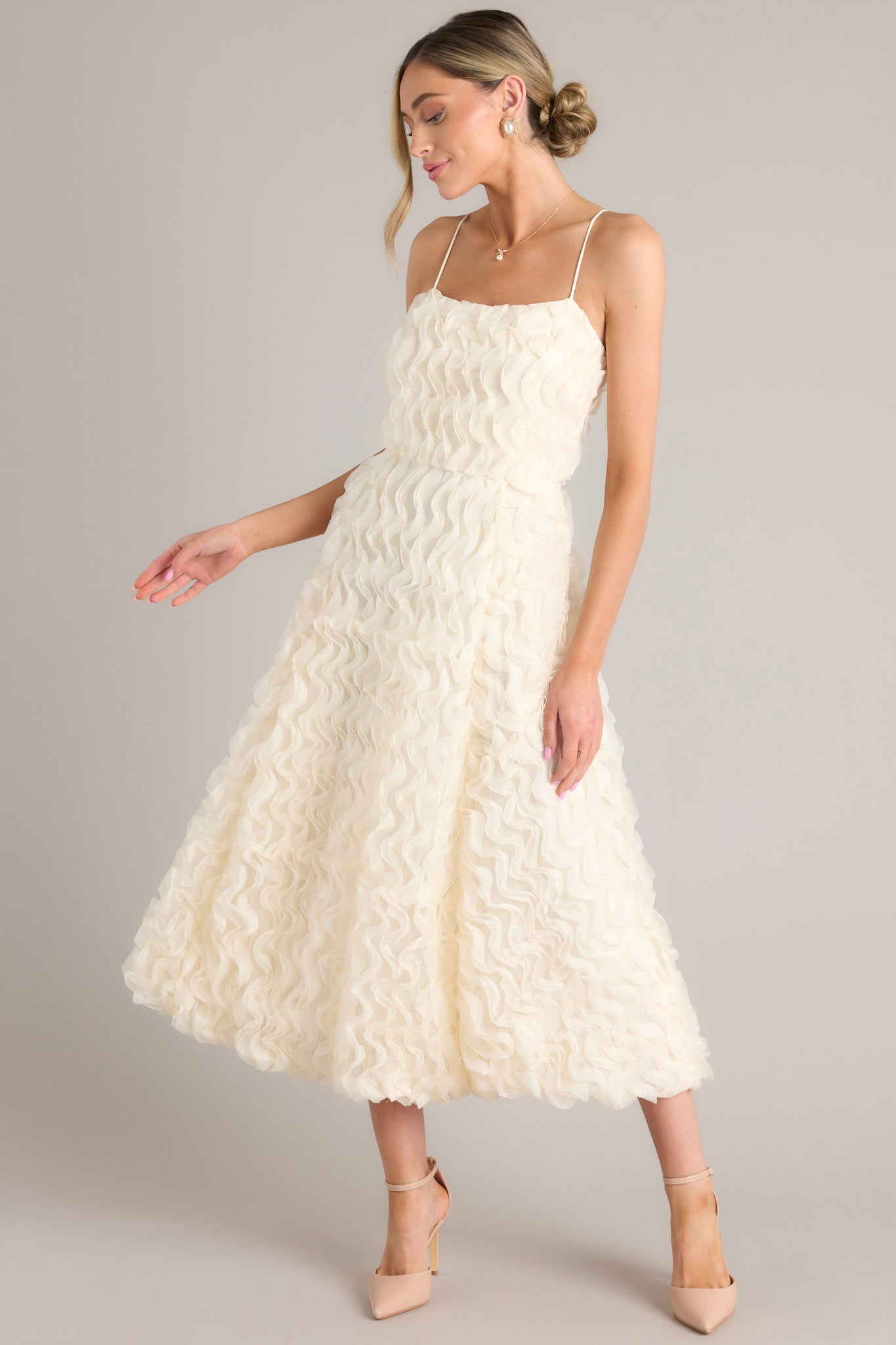 Full body view of this dress that features a wavy textured overlay.