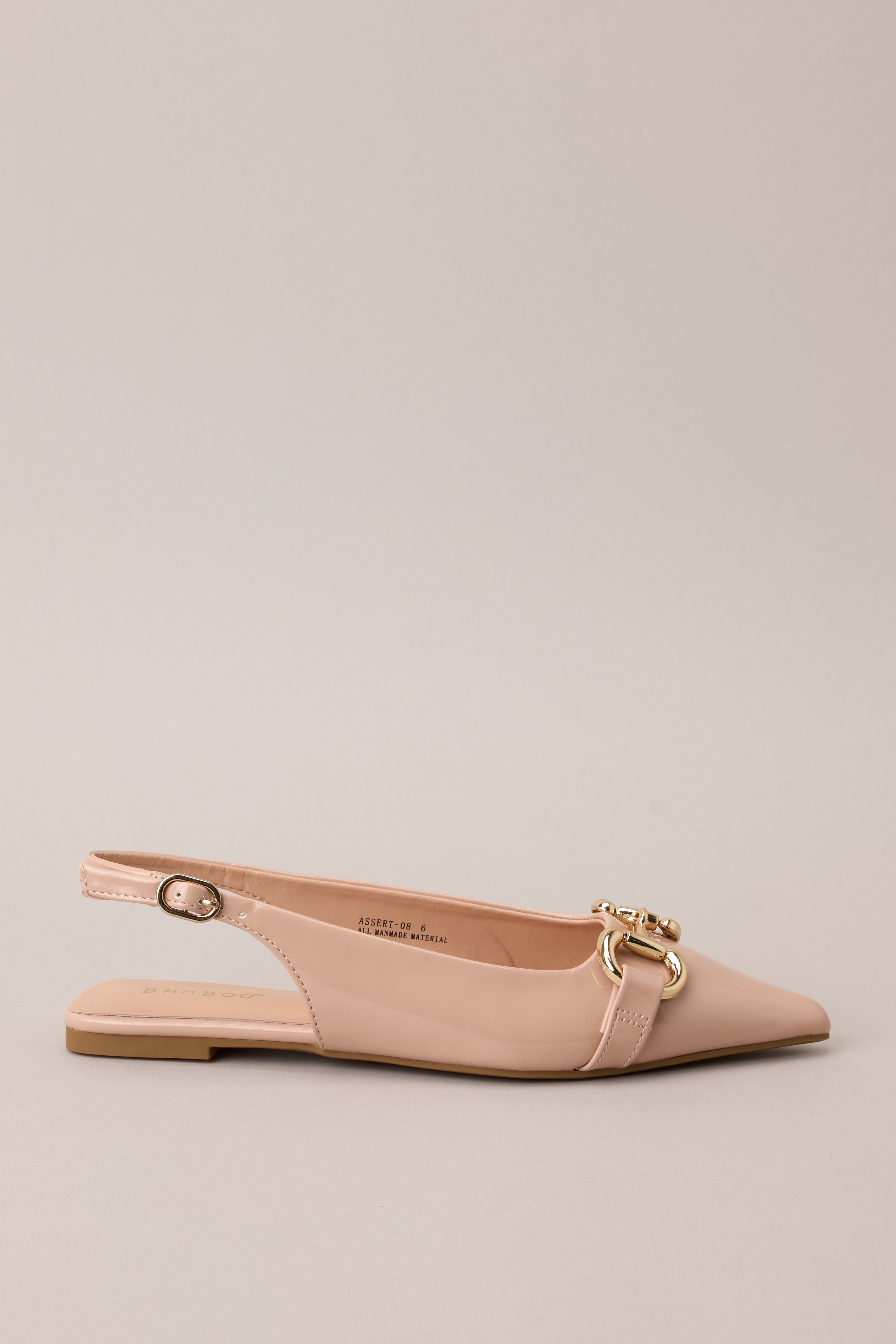 Side view of these Chic pointed-toe flats with gold hardware and adjustable heel strap.