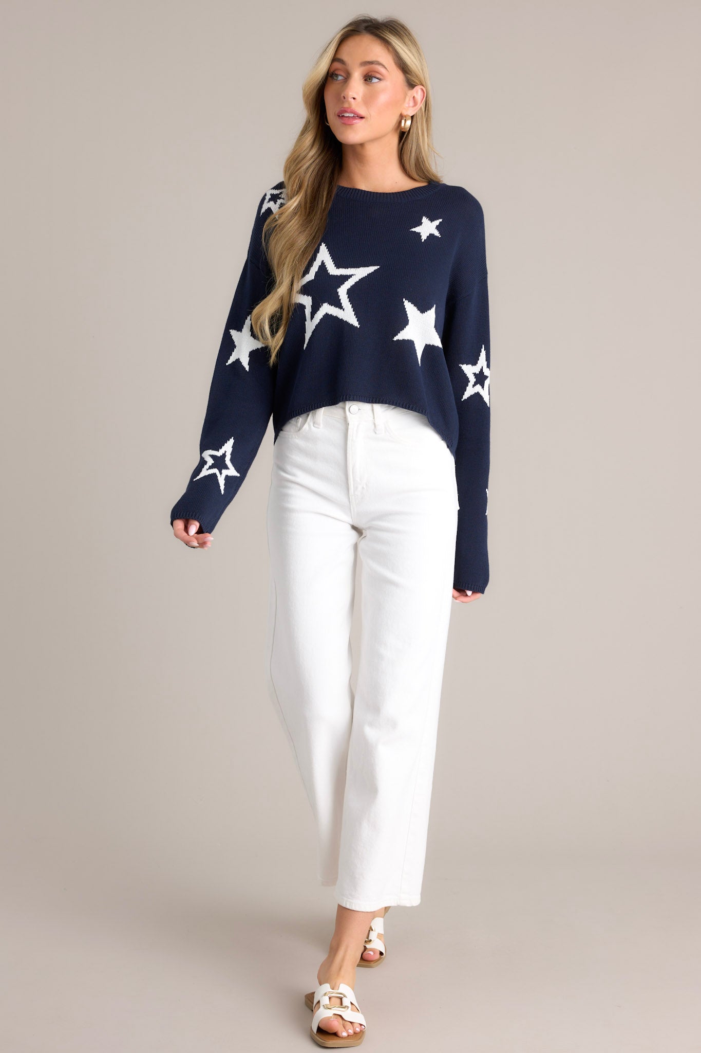 Full body view of this top that features a crew neckline, a slightly cropped style, a fun star print, and a relaxed fit.