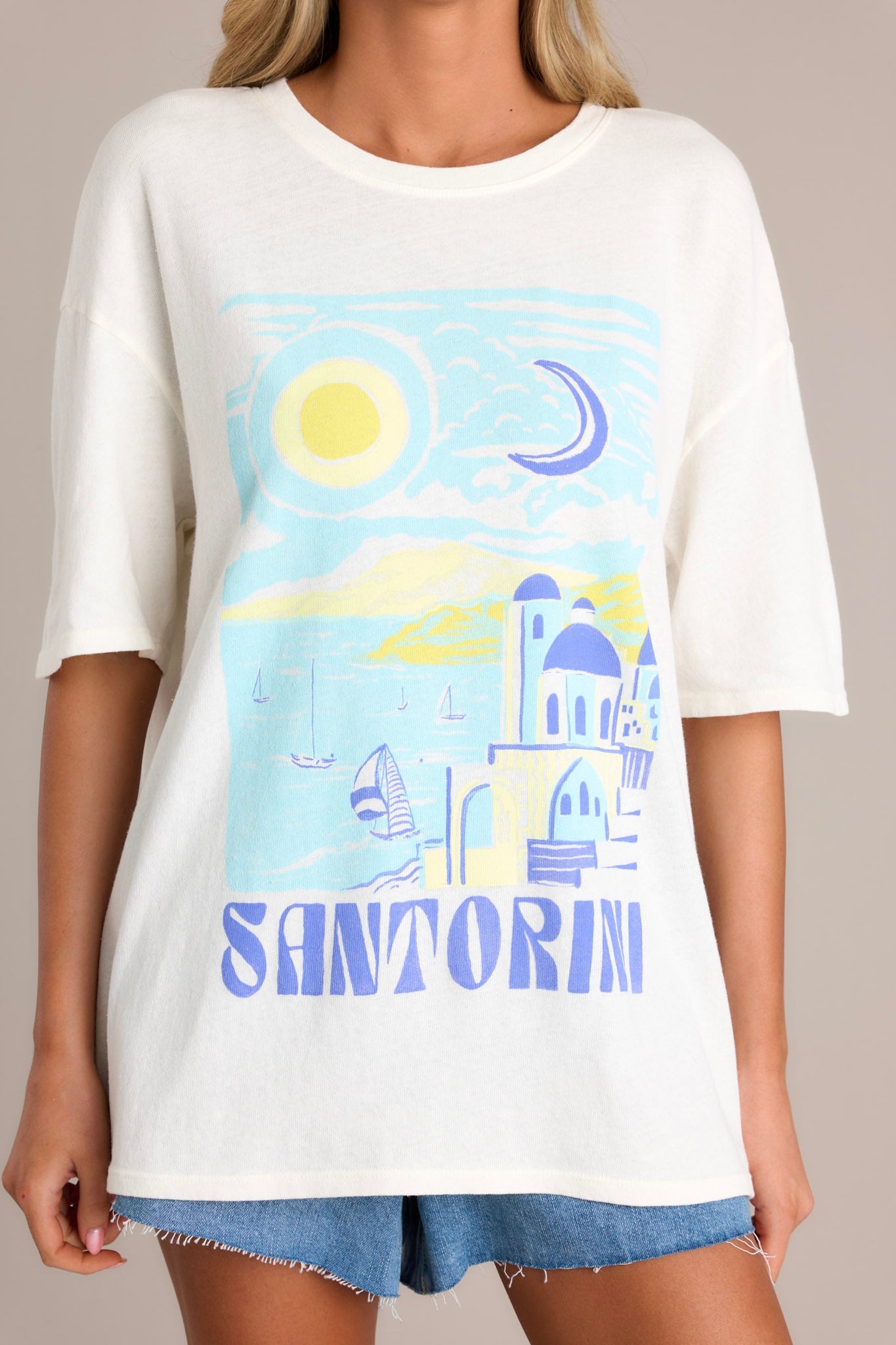 Front view of a tee featuring a crew neckline, a washed graphic, and an oversized fit.